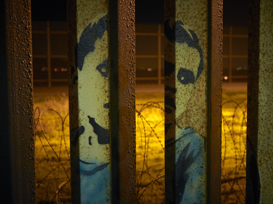 President Trump's proposal to end the partial government shutdown includes not only funding for an expanded border wall, parts of which can be seen from Tijuana, Mexico, but also provisions that further restrict asylum seekers. (Gregory Bull/AP)