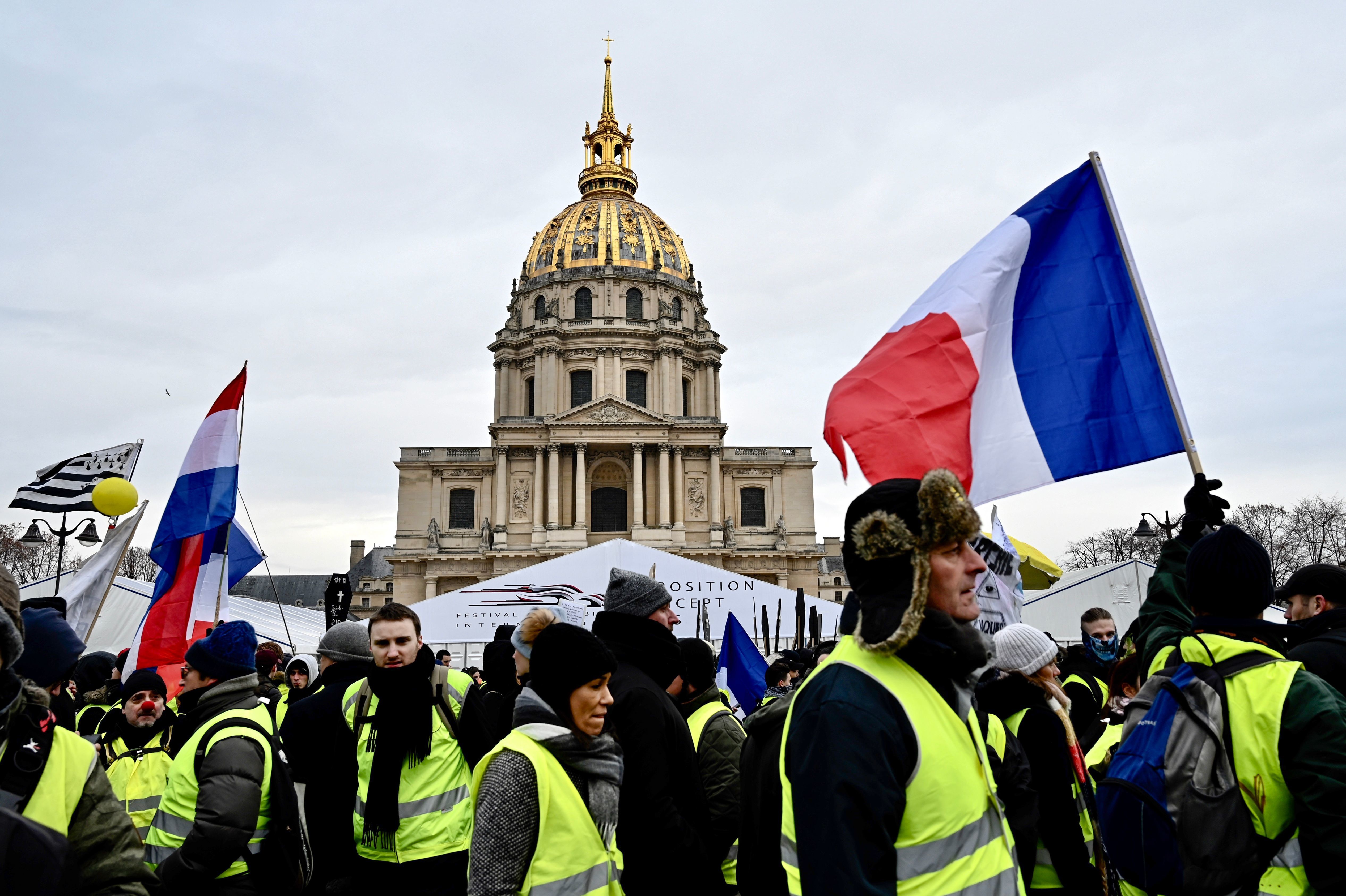 Protesters take part in an antigovernment yellow vest demonstration in front of the Hôtel National des Invalides in Paris early in January. (AFP/Getty Images)