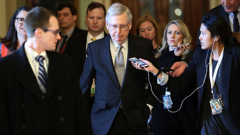 Senate Majority Leader Mitch McConnell, R-Ky., is trailed by reporters after speaking on the Senate floor on Tuesday.