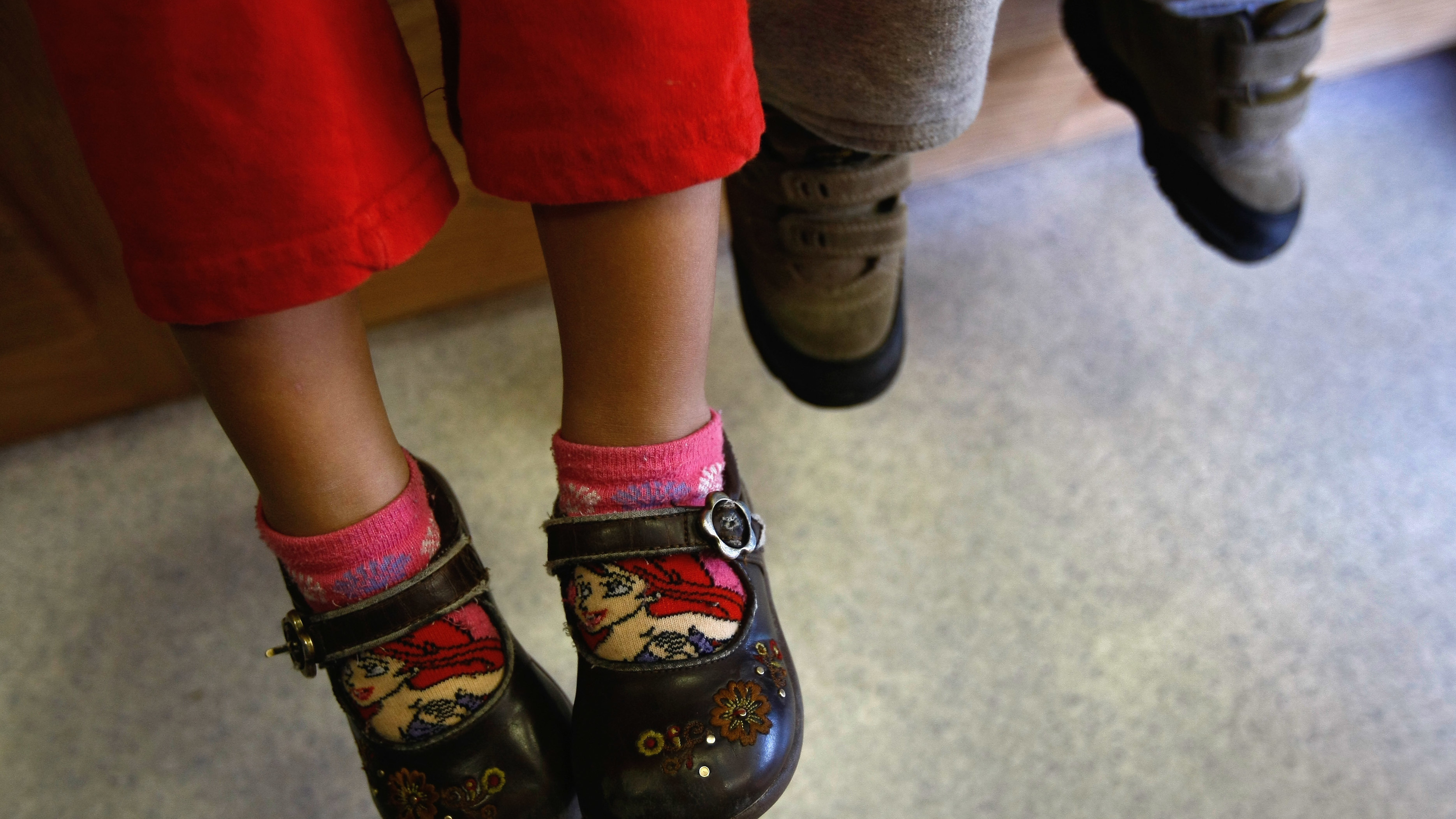 Children of Mexican immigrants wait to receive a free health checkup inside a mobile clinic at the Mexican Consulate in Denver, Colo., in 2009. The Trump administration wants to ratchet up scrutiny of the use of social services by immigrants. That