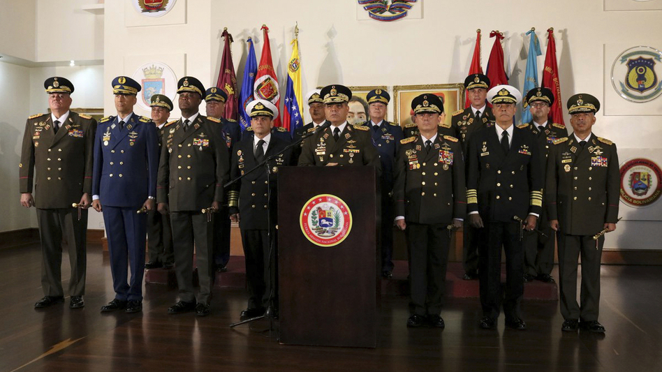 Defense Minister Vladimir Padrino López delivers a message of support for Venezuelan President Nicolás Maduro in Caracas, Venezuela, on Thursday. A half-dozen generals belonging largely to district commands and with direct control over thousands of troops joined Maduro in accusing the United States of meddling in Venezuela's affairs and said they would uphold the socialist leader's rule. (Venezuelan Defense Ministry press office via AP)