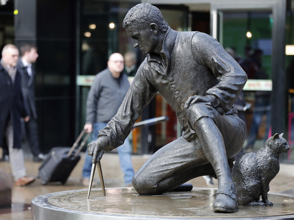 The Matthew Flinders statue at Euston Railway station in London. His cat Trim is portrayed on the right.