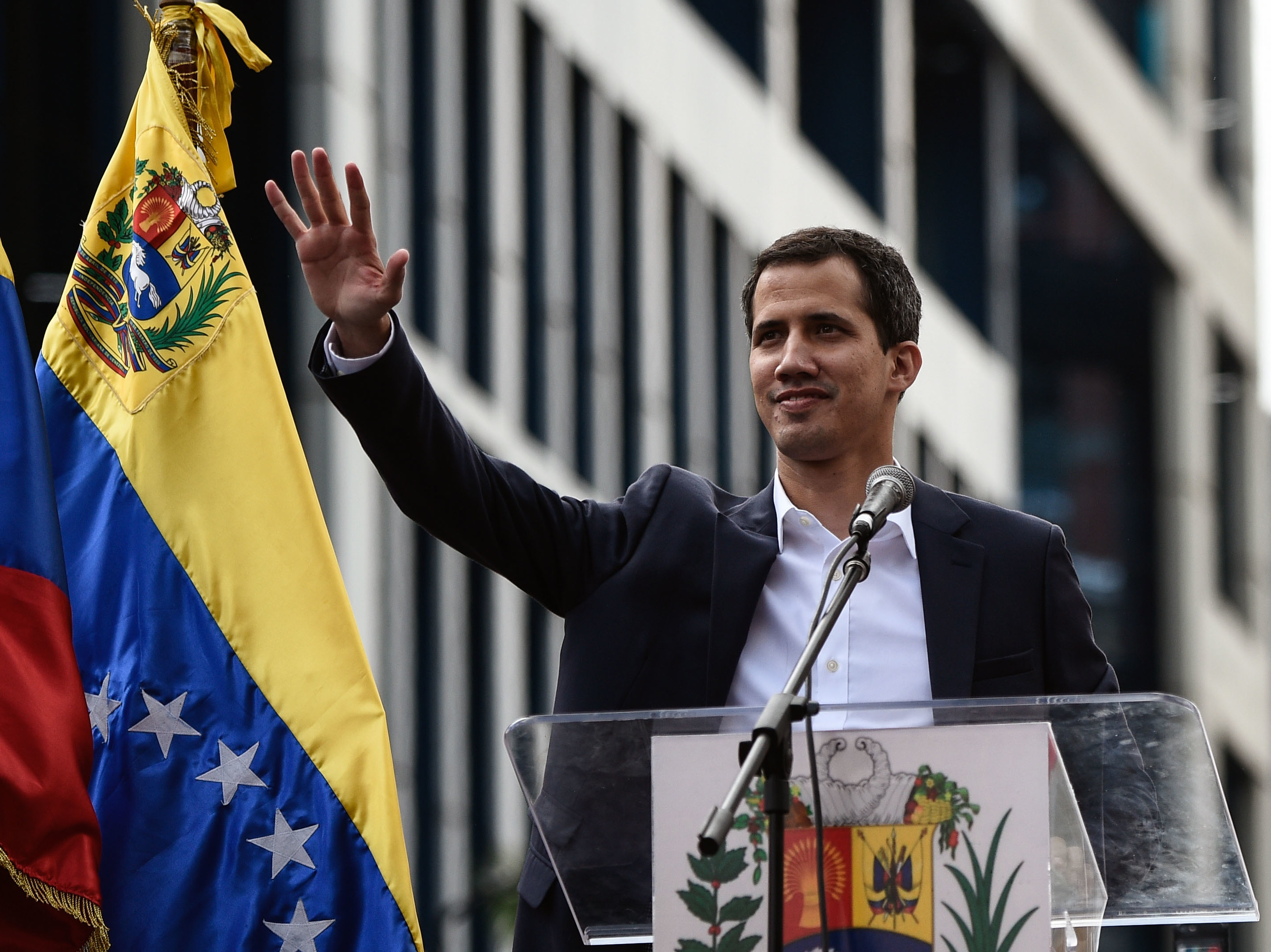 Venezuela's National Assembly head Juan Guaidó waves during a mass opposition rally, during which he declared himself the country's acting president on Jan. 23. (AFP/Getty Images)