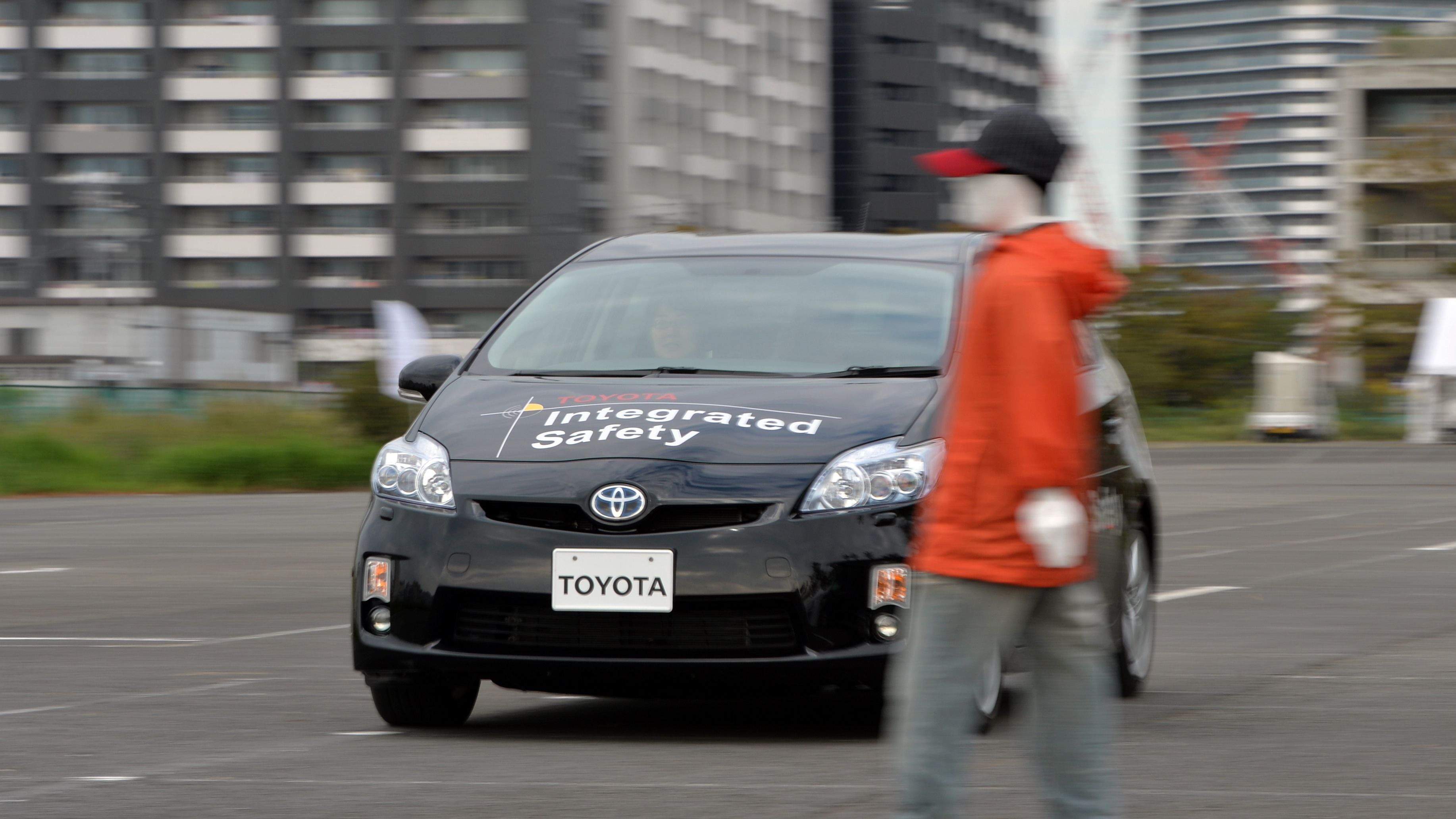 Toyota demonstrates its &quot;pre-collision system,&quot; which uses automatic steering in addition to automatic braking to prevent collisions, in Tokyo in 2013. Different manufacturers use different names for systems like this, which can be confusing, a AAA report found. (AFP/Getty Images)