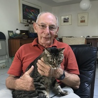 Peter Tarjan of Miami and his cat Jodi. Tarjan's grandparents and parents died in the Holocaust. The Holocaust Memorial Museum recently hired a full-time curator in South Florida to collect objects from Holocaust survivors to preserve history.