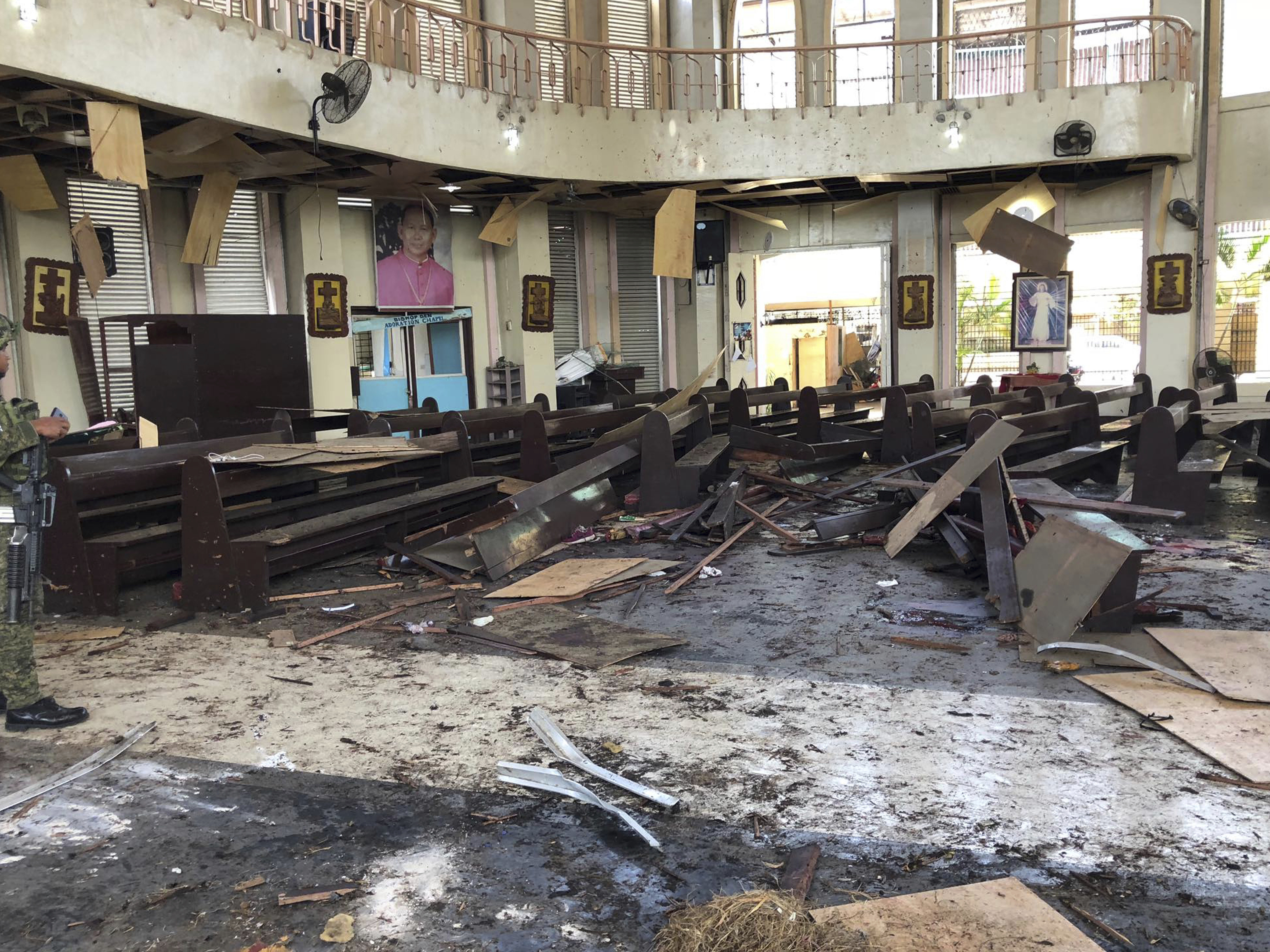 The Philippine government says it will "pursue to the ends of the earth the ruthless perpetrators" behind bomb attacks that killed at least 20 people and wounded many more during a Sunday Mass at a cathedral in Jolo.