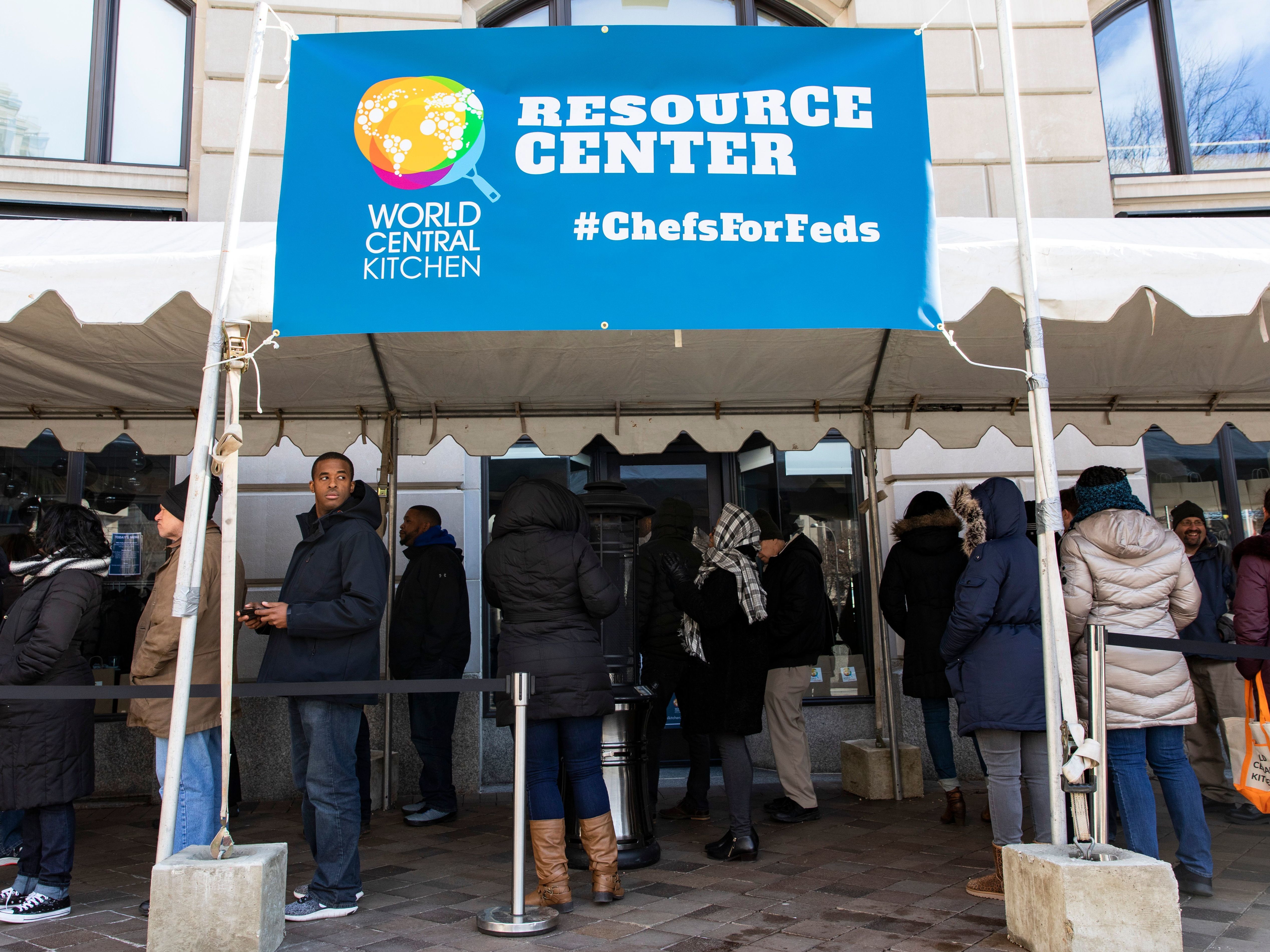 Federal employees wait in line at World Central Kitchen, a food bank and food distribution center established by celebrity chef José Andrés. The federal government is back open, but it could be several days before workers receive missed paychecks. (AFP/Getty Images)