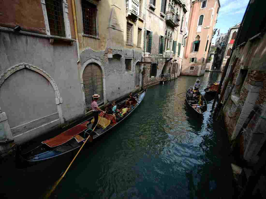 A gondola sails in a Venice canal in September.