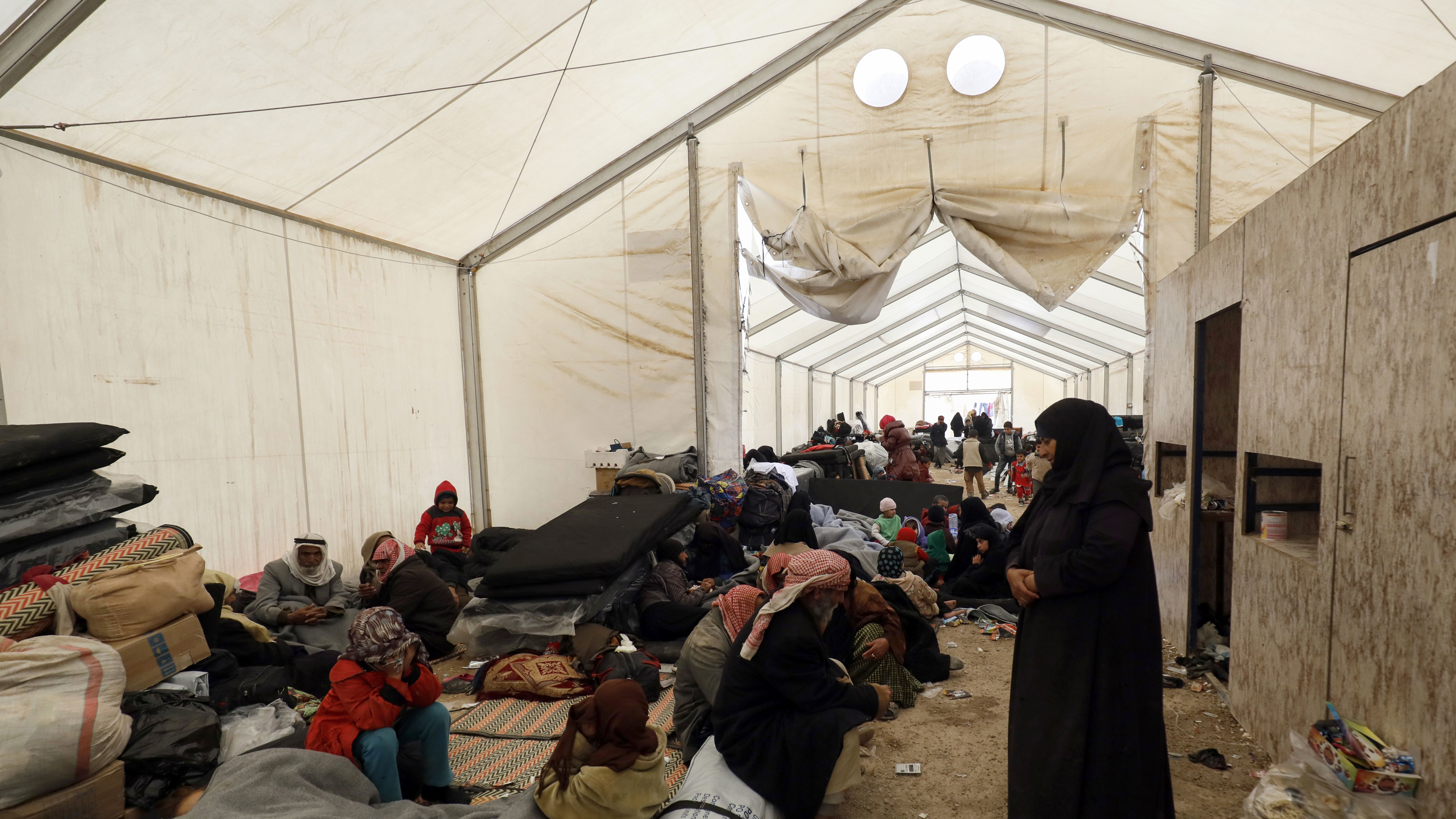 Displaced Syrians gather inside a tent in the al-Hol camp in northeastern Syria in December. (AFP/Getty Images)