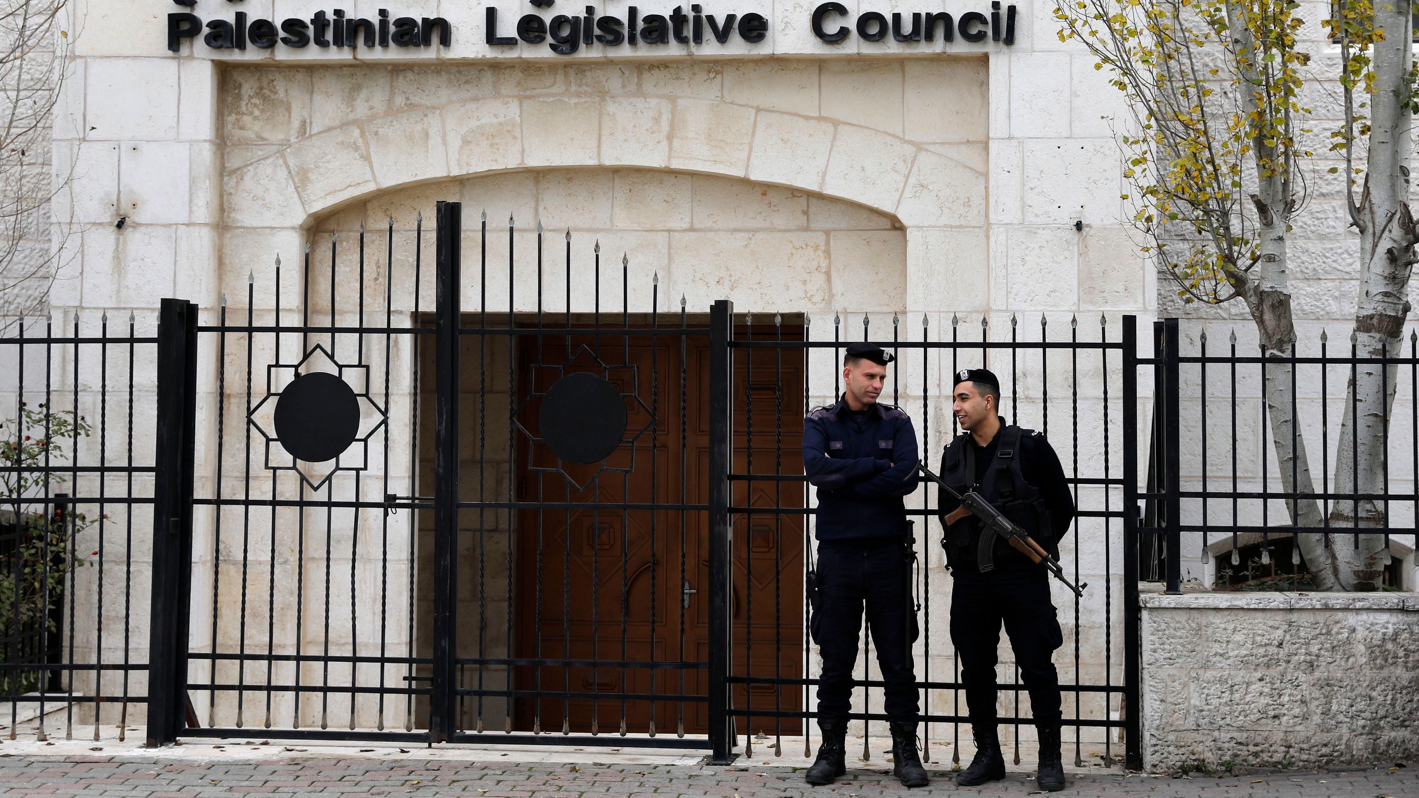 Palestinian security forces gather in front of the Palestinian Legislative Council building in Ramallah in the Israeli-occupied West Bank in December.
