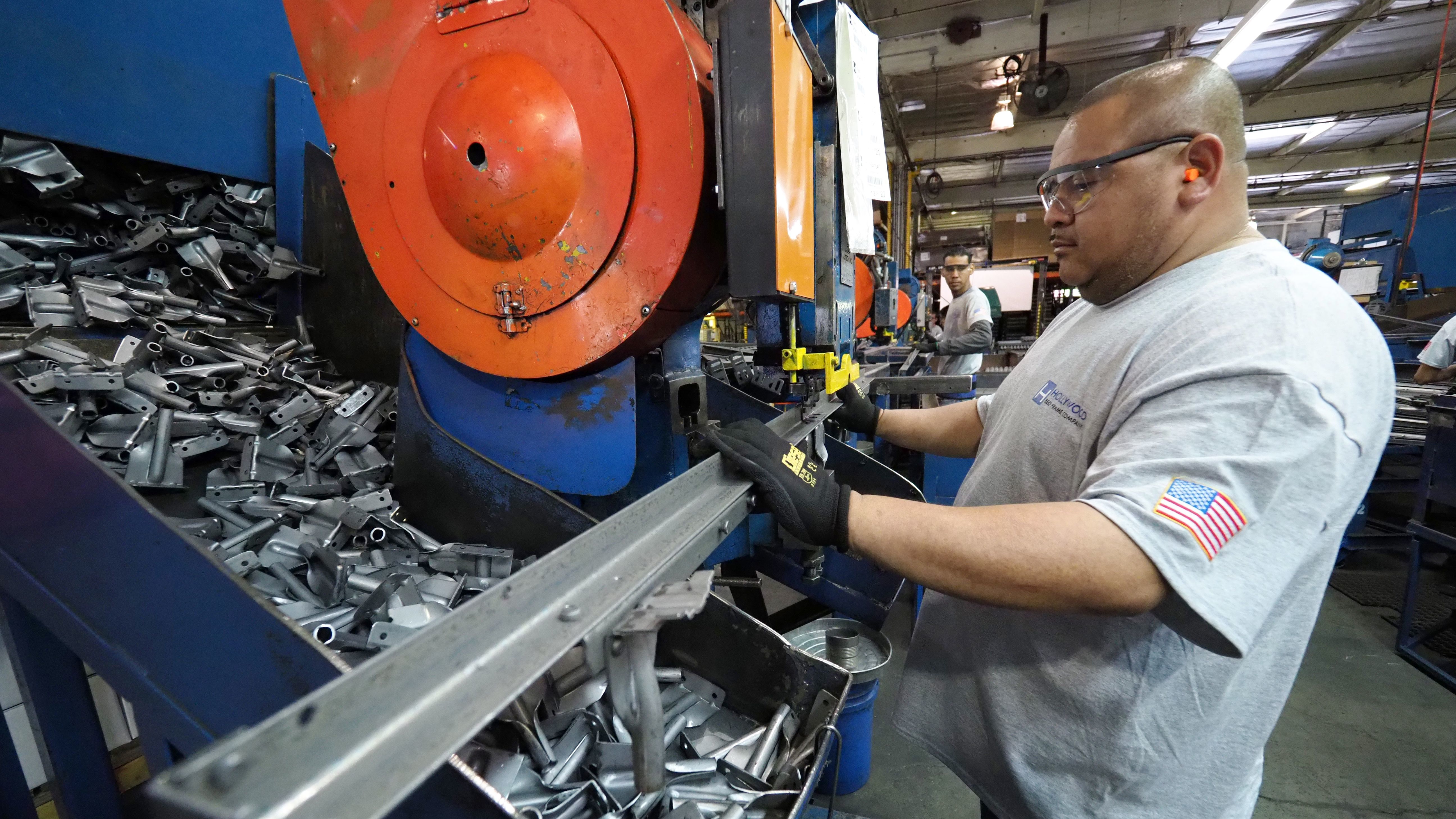 Workers build bed frames at a factory in Commerce, Calif., near Los Angeles, in 2017. In January, the economy added a bigger-than-expected 304,000 jobs, including 13,000 in manufacturing.