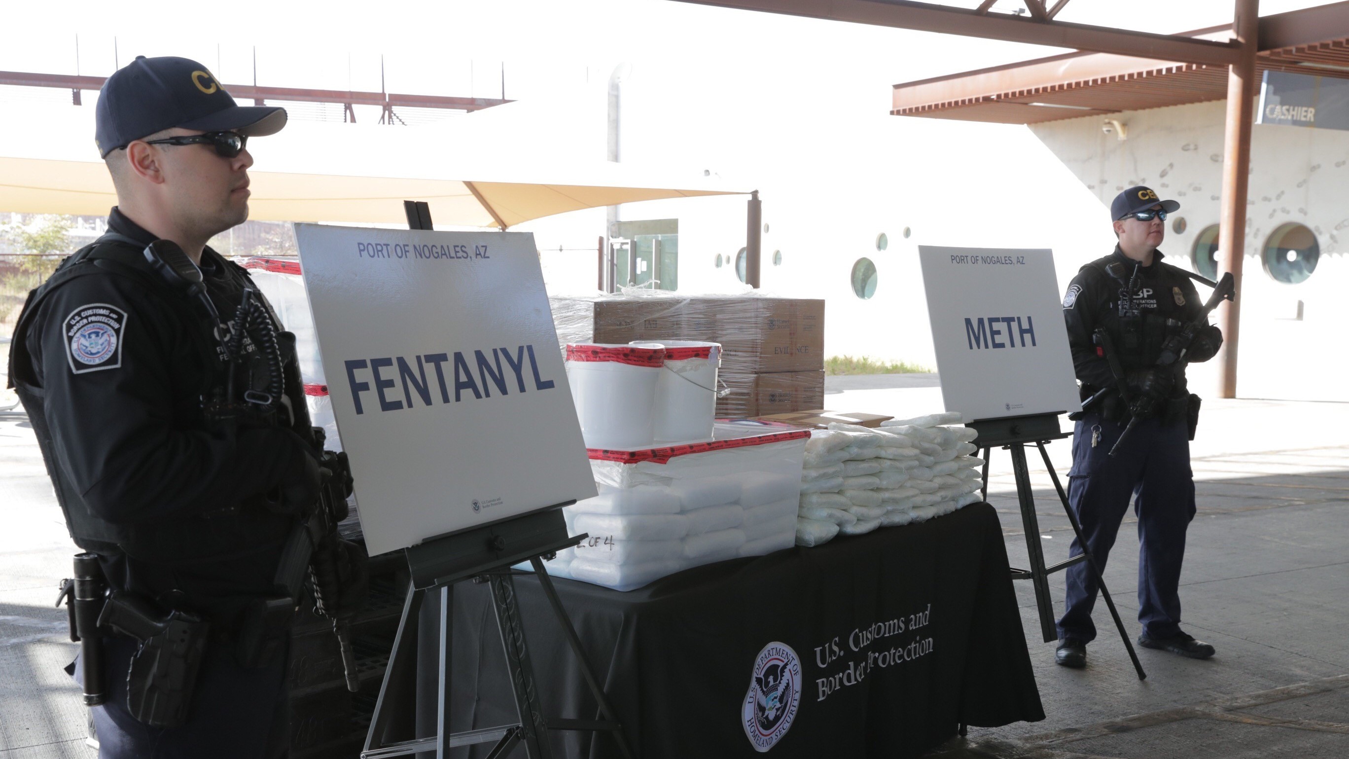 CBP agents, pictured Thursday, stand beside drugs seized last weekend at Arizona