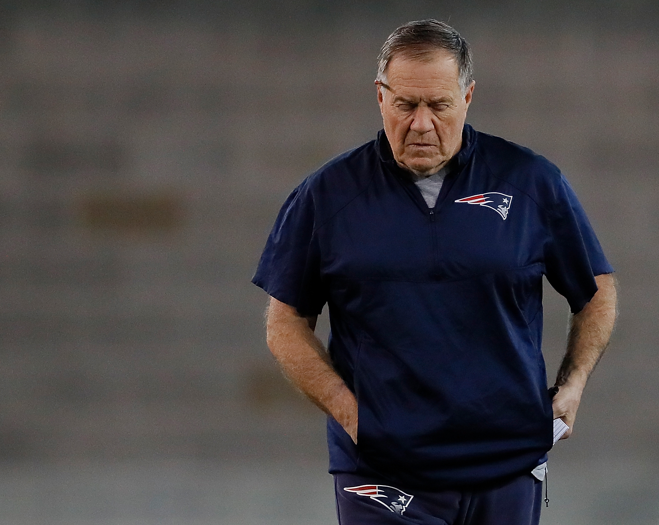 New England Patriots head coach Bill Belichick walks the field during Super Bowl practice on Feb. 1, 2019.