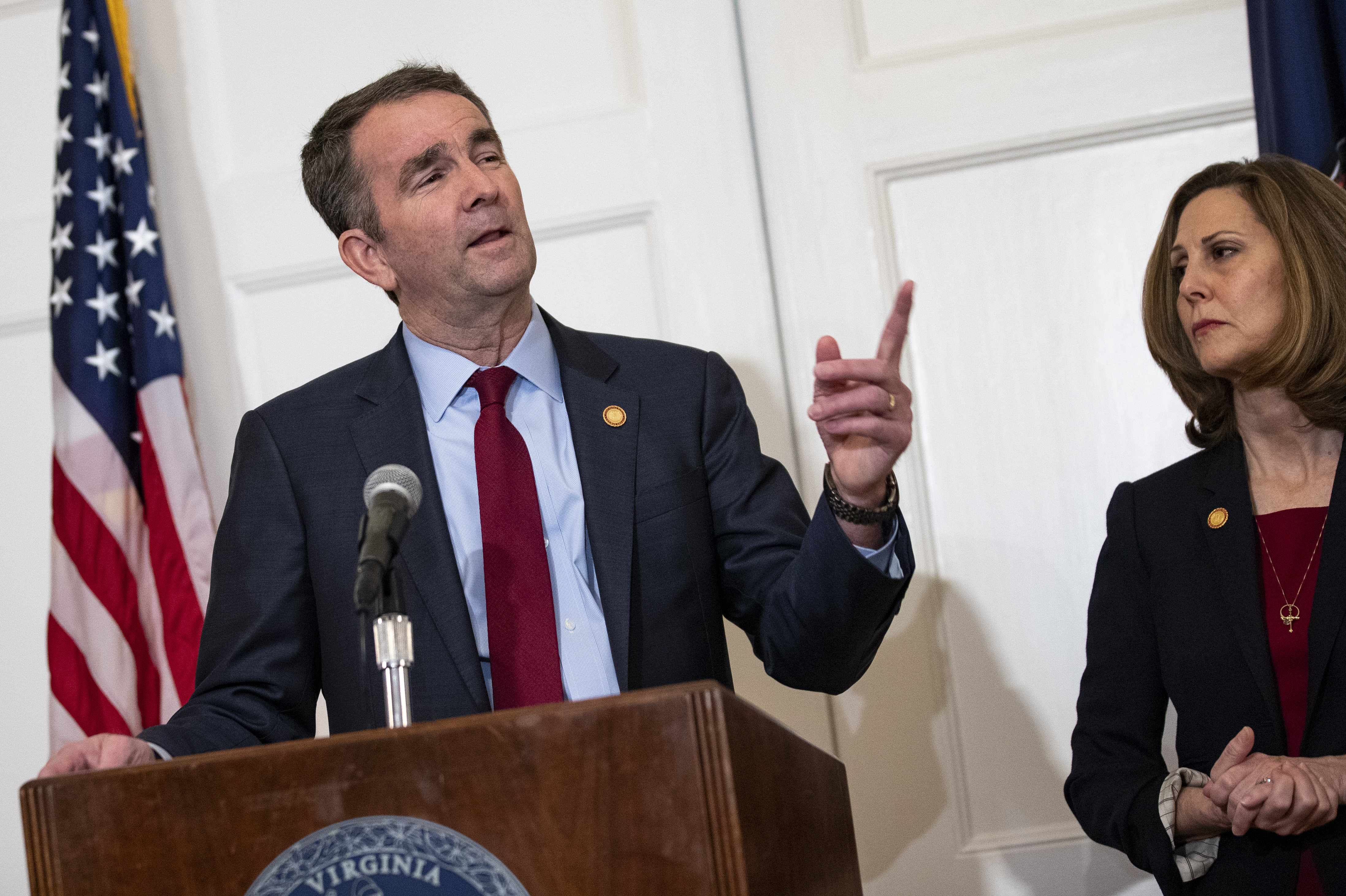 Virginia Gov. Ralph Northam, with his wife, Pam, speaks with reporters at a news conference Saturday in Richmond, Va. (Getty Images)