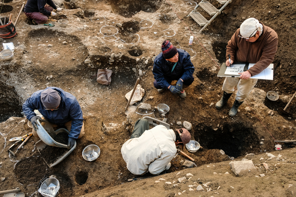 Archaeological workers dig for historical artifacts on the former site of the Jyokyo-ji temple in Kyoto.