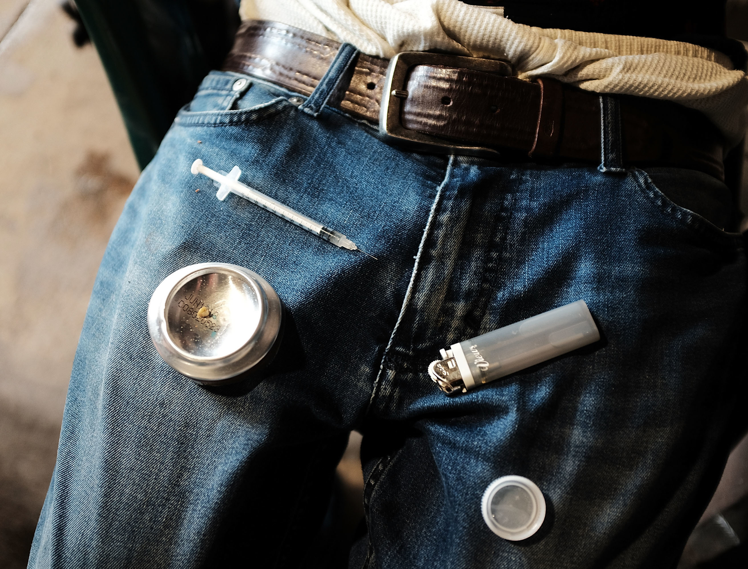 A man uses heroin under a bridge where he lives with others addicted to opioids in the Kensington section of Philadelphia. Public health officials hope opening up a medically supervised drug injection site could curb opioid overdoses and facilitate treatment.