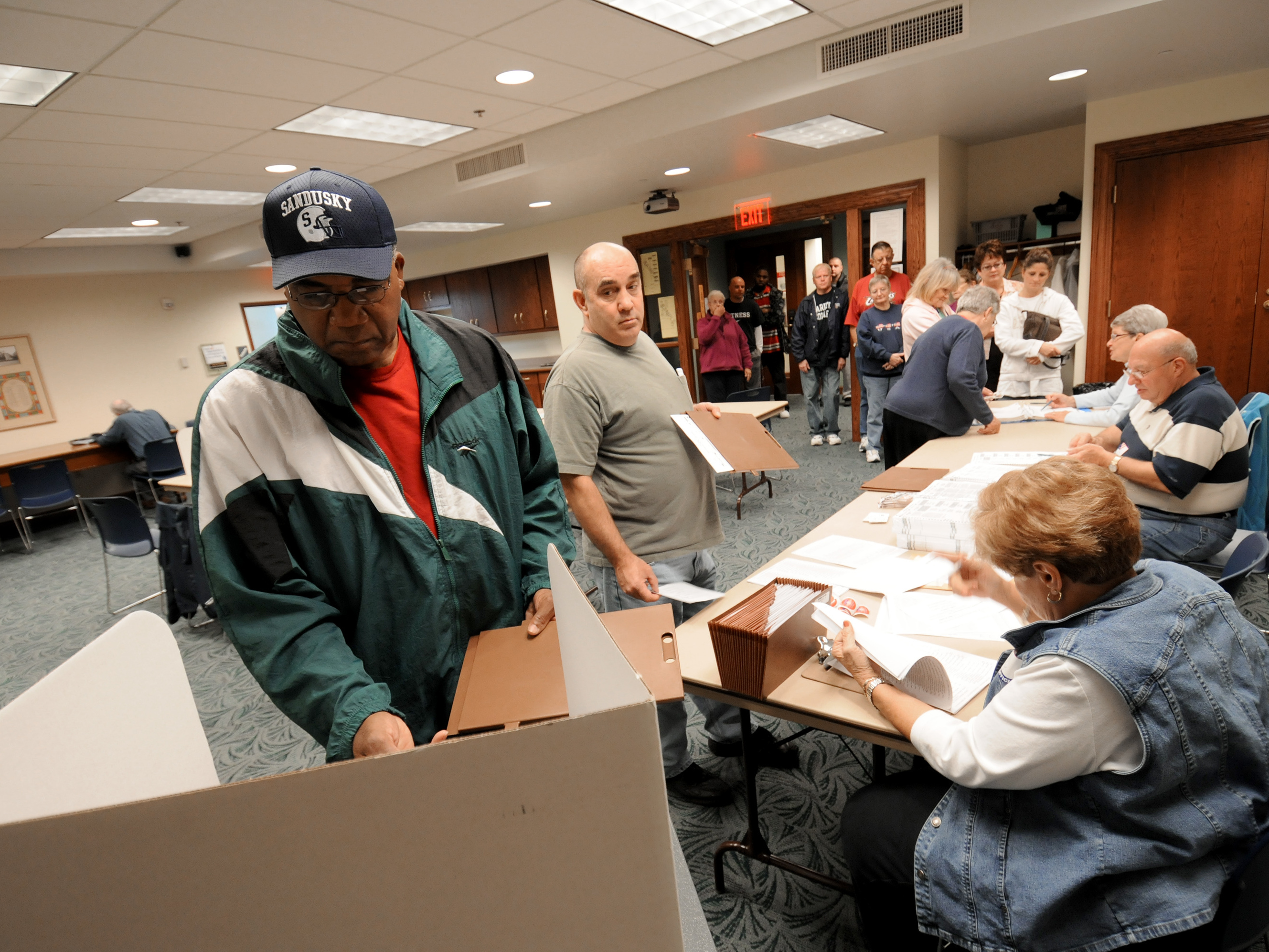 Commissioners in Sandusky, Ohio, have voted to make Election Day a city holiday, in place of Columbus Day. Sandusky resident Moses Croom is seen here voting at a polling station at a local library in November 2008. (Sandusky Register)