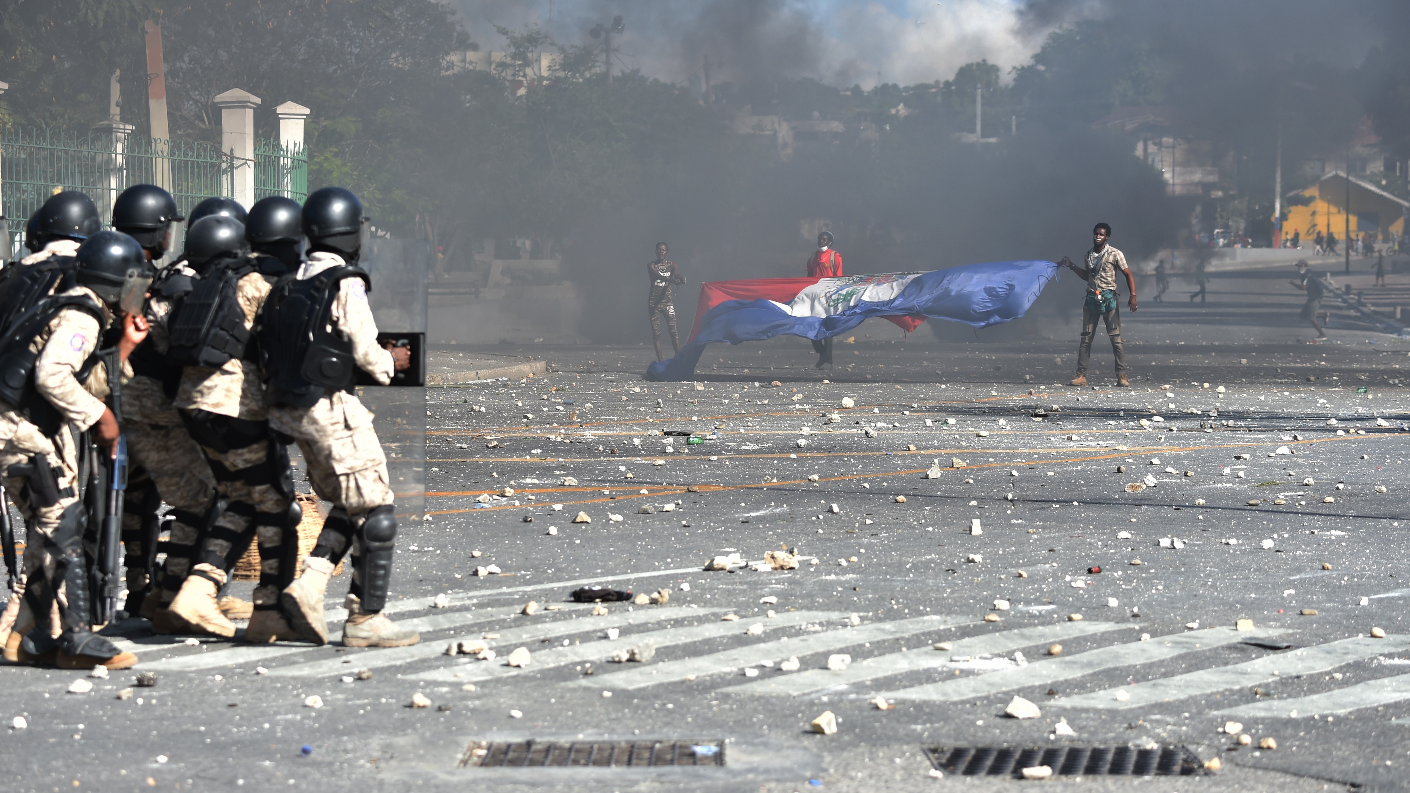 Haitian police have struggled to control street protests as demonstrators call for President Jovenel Moise to resign over alleged misuse of the Petrocaribe fund. (AFP/Getty Images)