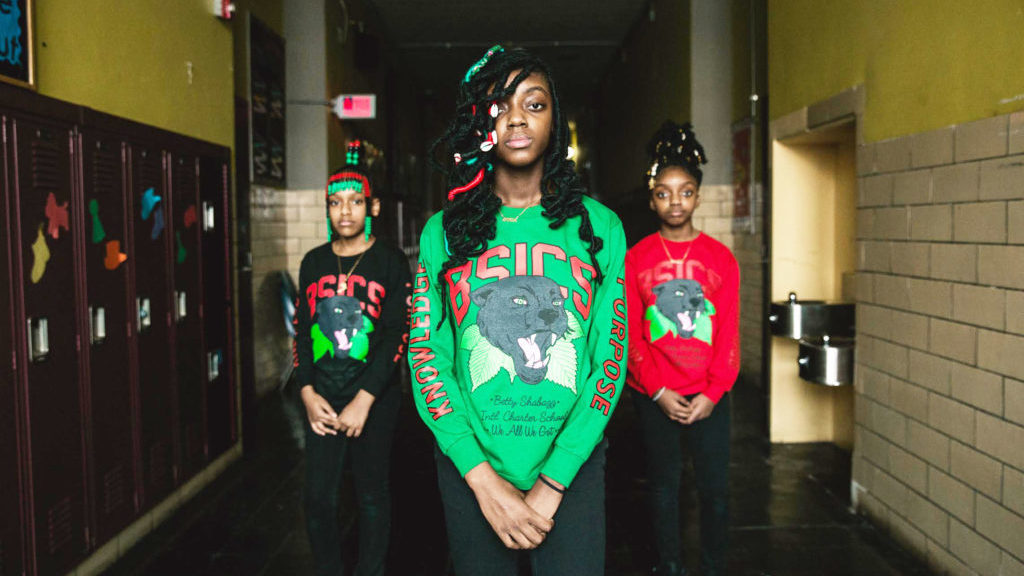 Students at Betty Shabazz Academy in Chicago show off Desmond "Des Money" Owusu