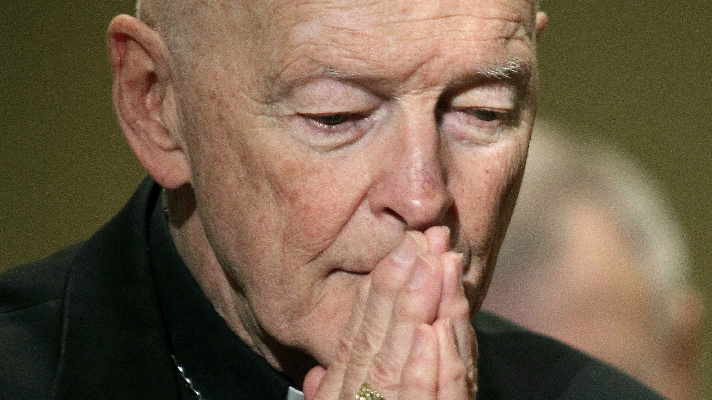 Theodore McCarrick prays in a 2011 photo. He has been accused of abusing minors and adults over a nearly 50-year clerical career.