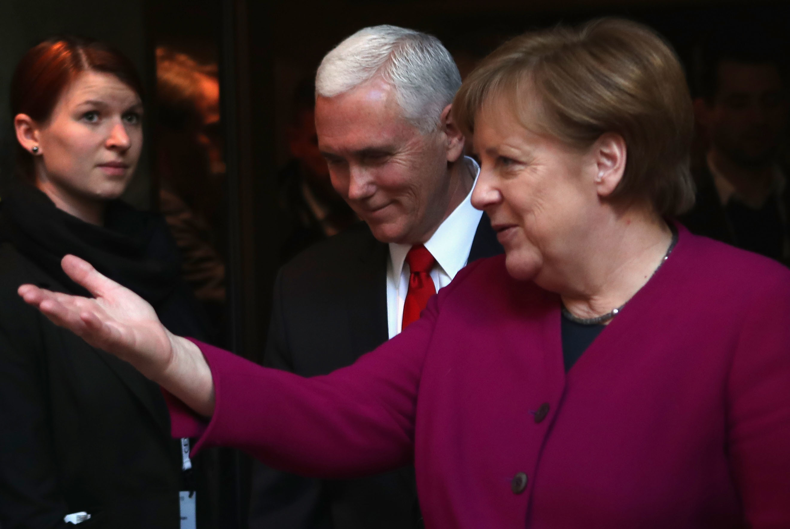 German Chancellor Angela Merkel and U.S. Vice President Pence talk at the Munich Security Conference on Saturday. (Getty Images)