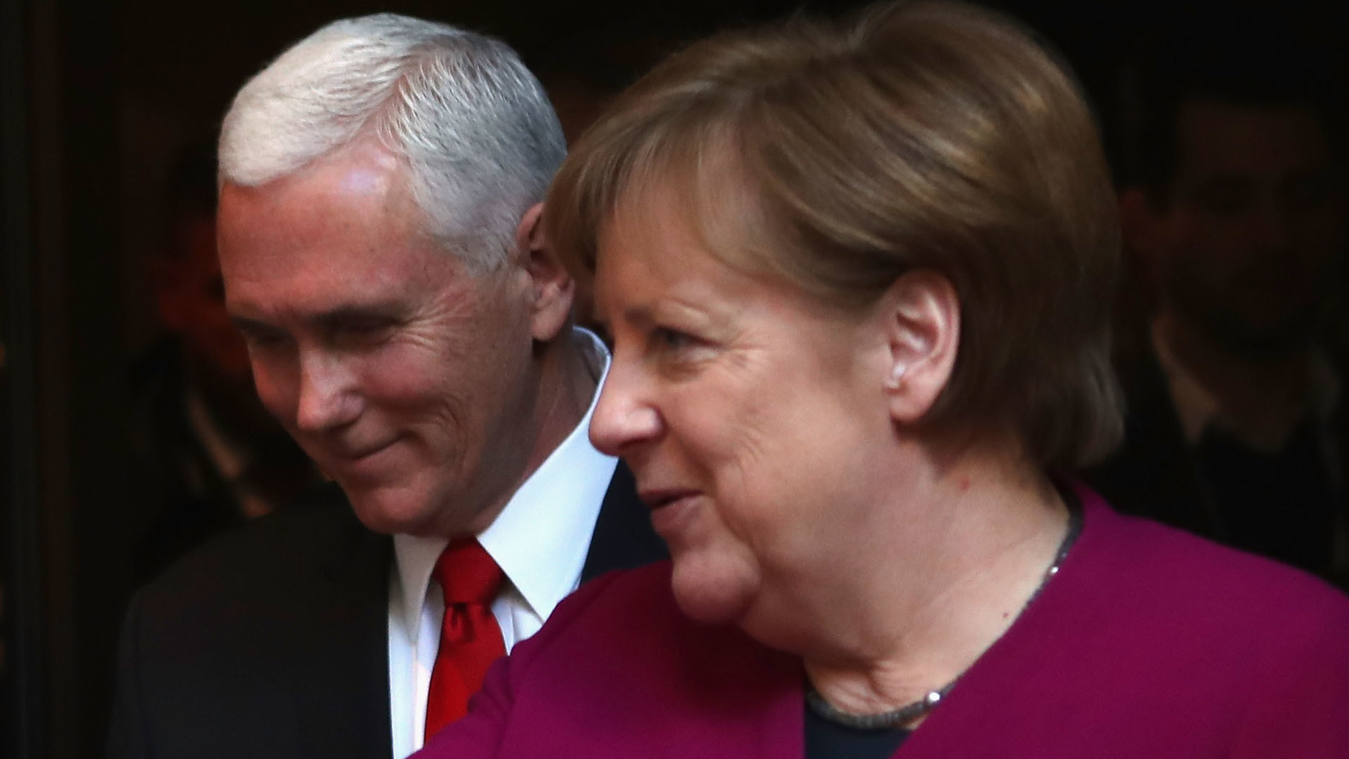 German Chancellor Angela Merkel (R) and U.S. Vice President Mike Pence talk at Munich Security Conference on Saturday.