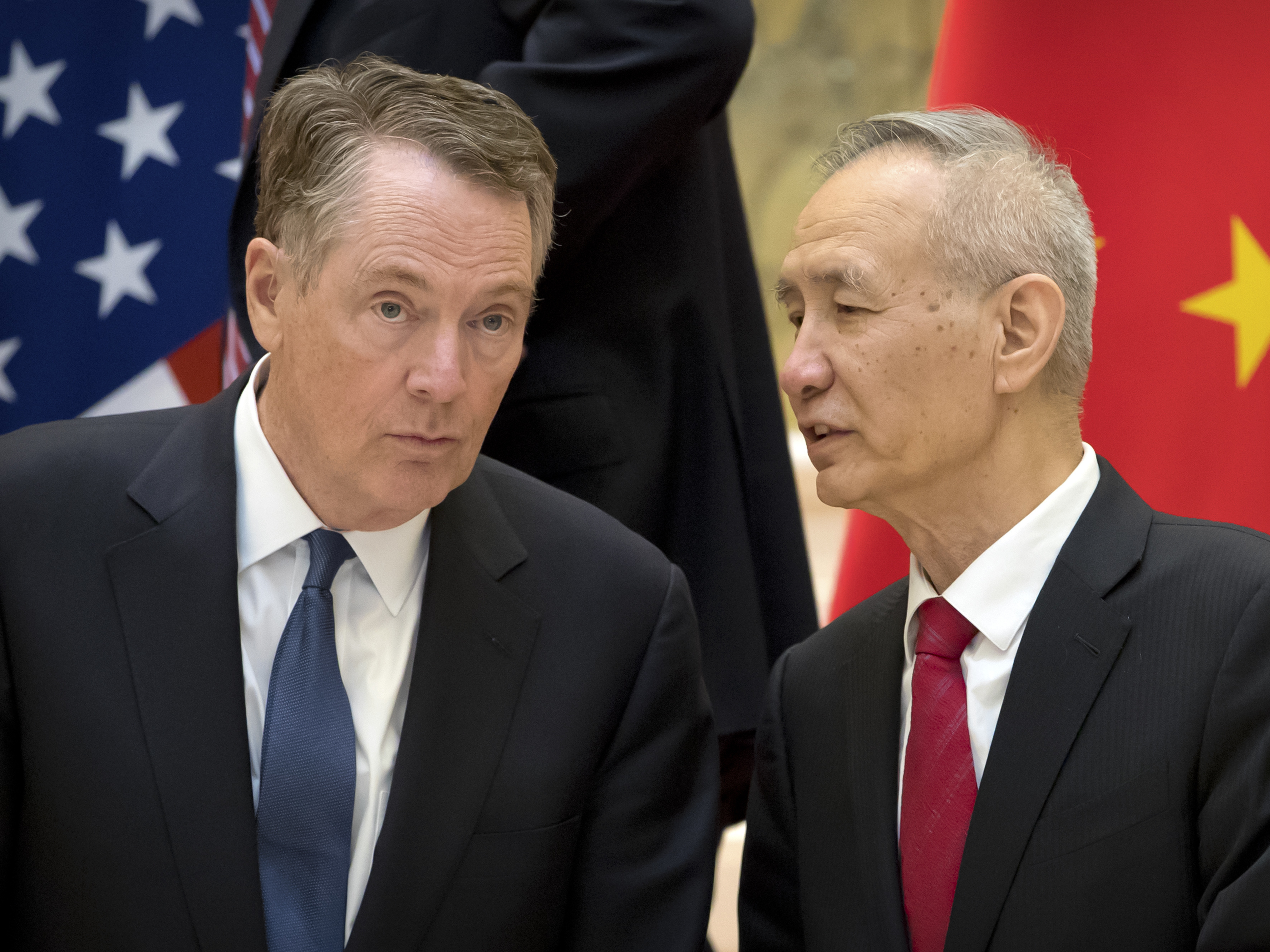 U.S. Trade Representative Robert Lighthizer, left, listens to Chinese Vice Premier Liu He at the Diaoyutai State Guesthouse in Beijing last week. The two will meet tomorrow as negotiations continue. (AFP/Getty Images)