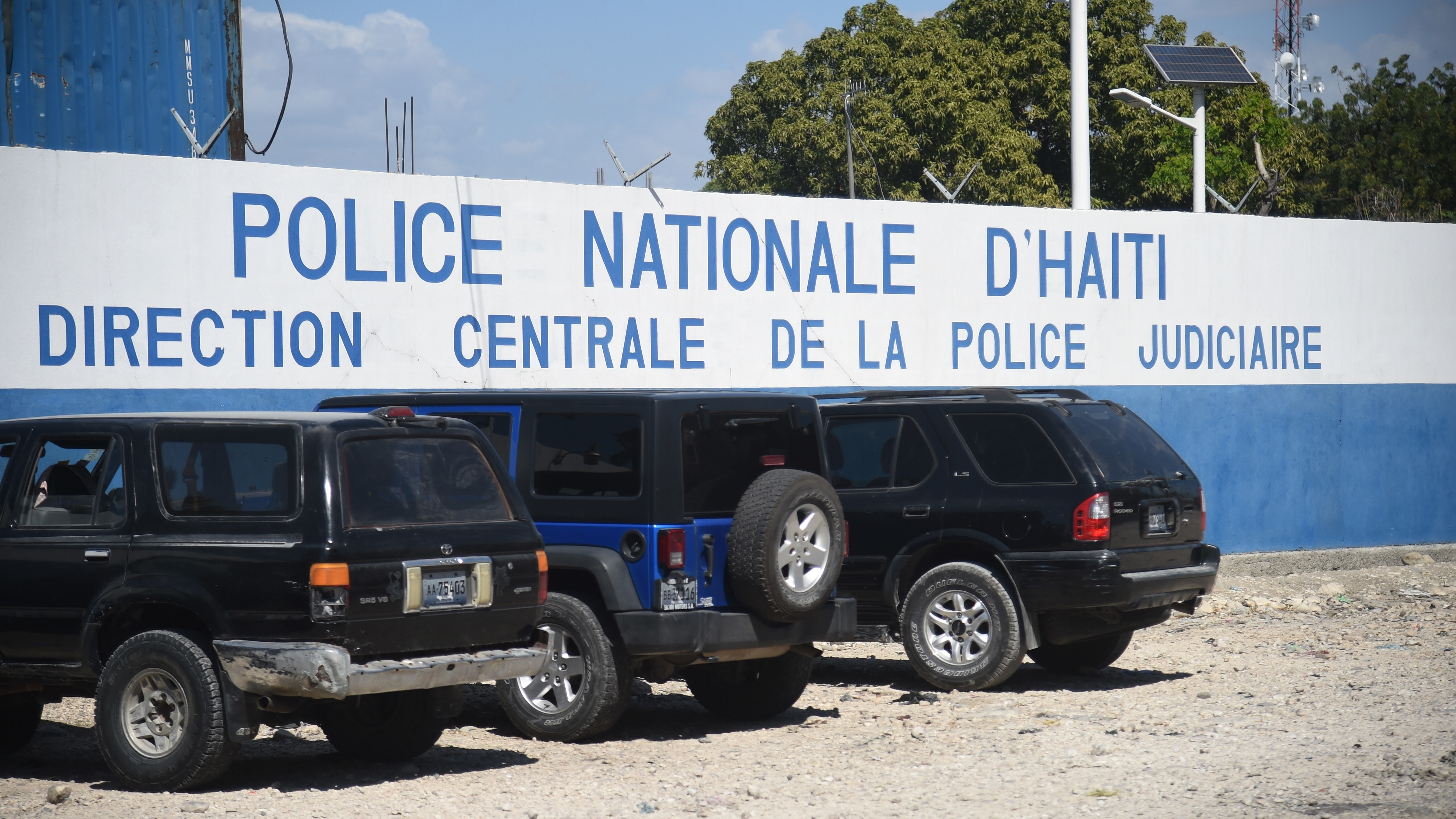 Five Americans and several other men were arrested after police discovered they were carrying a number of automatic rifles and pistols in Port-au-Prince. The men are being held at this Haitian National Police compound. (AFP/Getty Images)