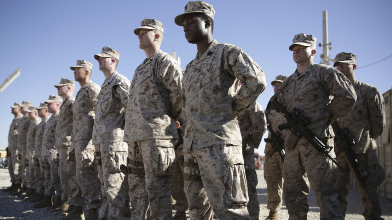 U.S. Marines stand guard during the change of command ceremony at Task Force Southwest military field at Shorab military camp in Afghanistan's Helmand province in 2018. (Massoud Hossaini/AP)