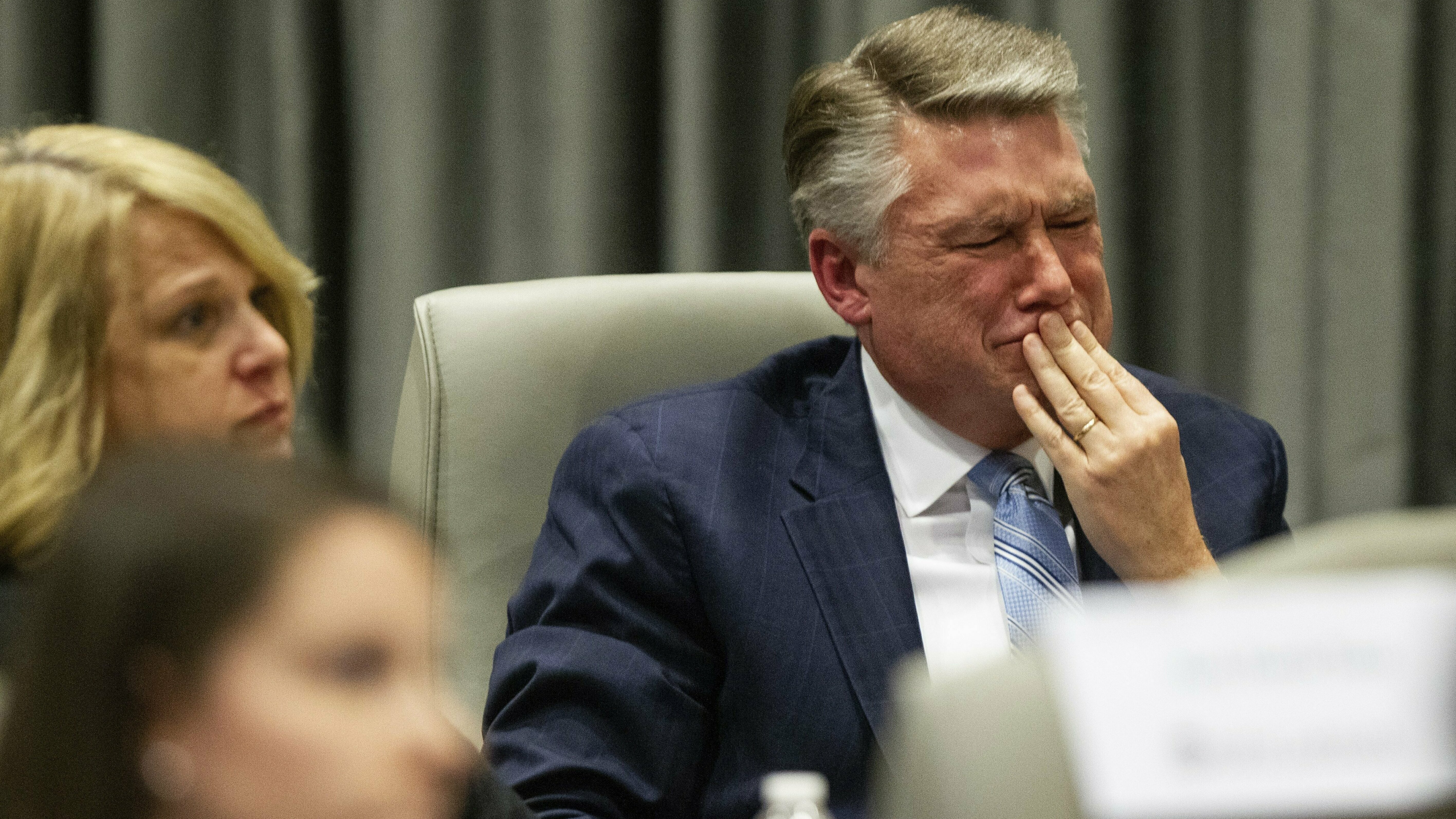 Mark Harris, Republican candidate in North Carolina's 9th Congressional race, fights back tears at the conclusion of his son John Harris' testimony during a public evidentiary hearing on the 9th Congressional District voting irregularities investigation last week.