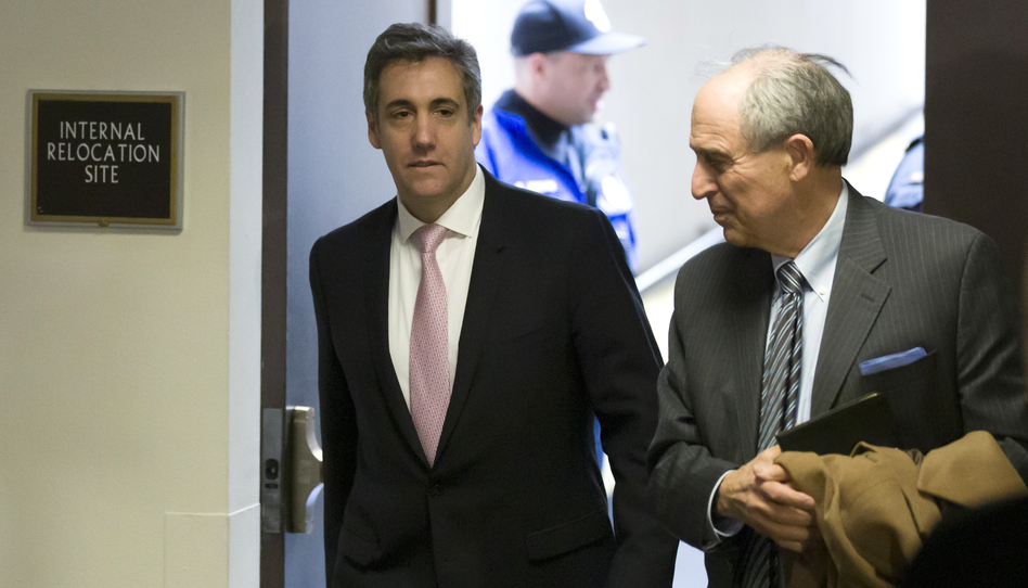 Michael Cohen (left), President Trump's former lawyer, arrives to testify before a closed hearing of the Senate intelligence committee, with his lawyer Lanny Davis on Tuesday. (Alex Brandon/AP)