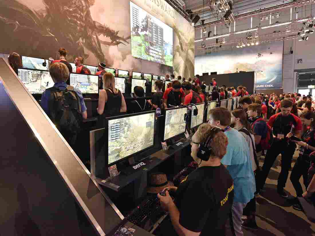 Participants play the latest video games at the gamescom computer game fair in Cologne, Germany, on Wednesday