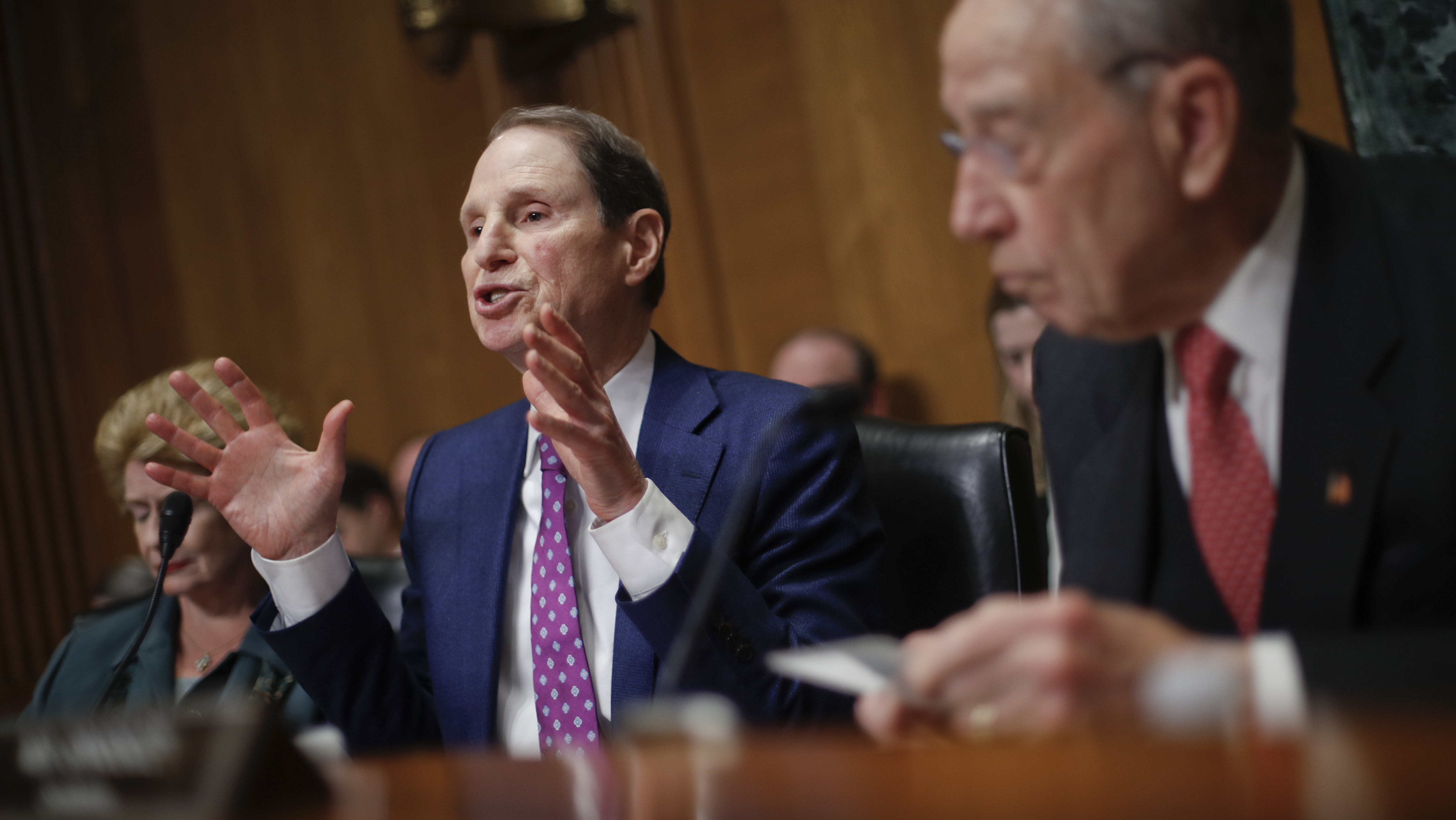 Sen. Ron Wyden, D-Ore., left, and Sen. Chuck Grassley, R-Iowa, right, chairman of the Senate Finance Committee, asked drug company CEOs some tough questions about drug prices on Tuesday during a hearing before the Senate Finance Committee.