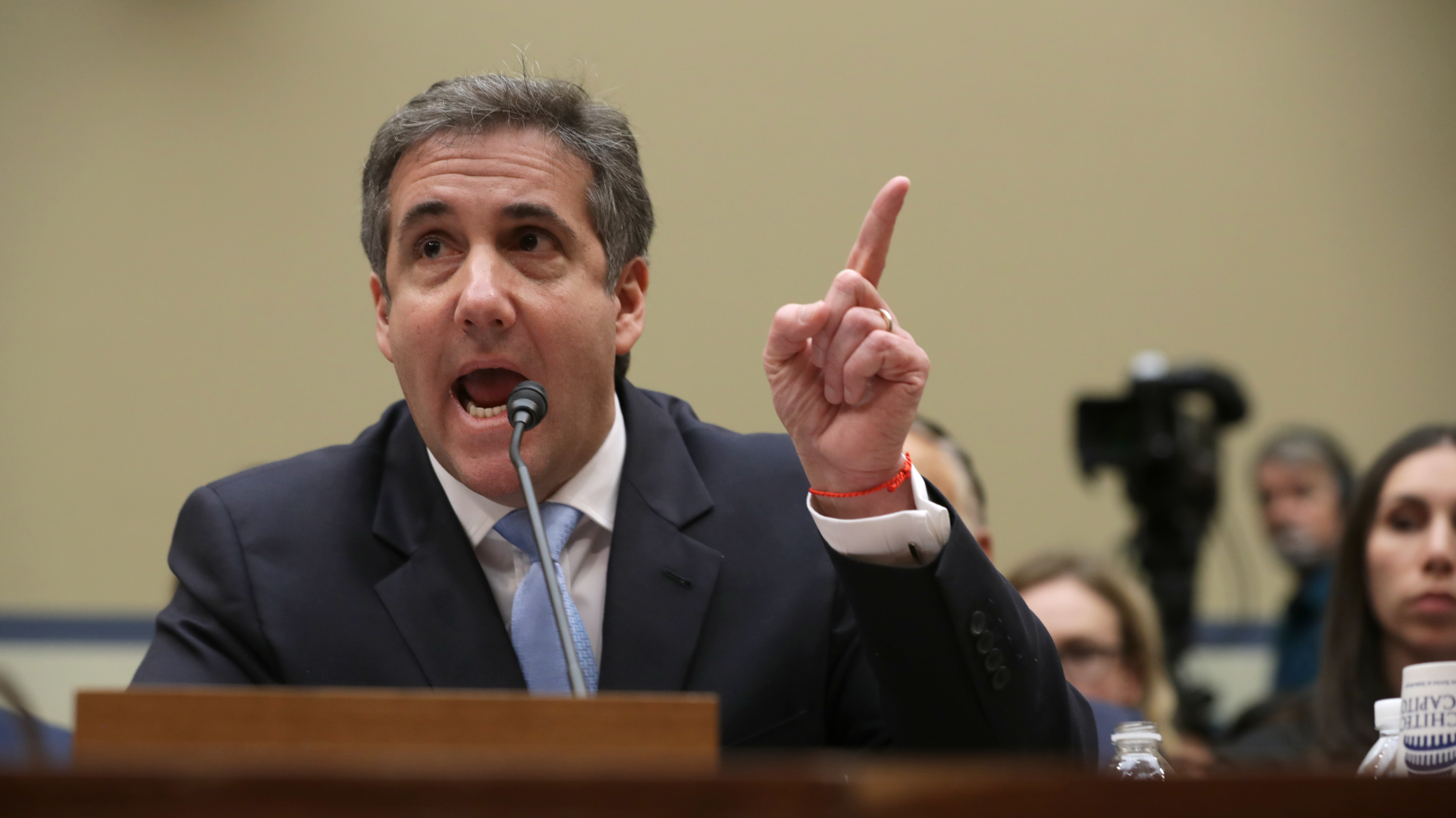 Michael Cohen, former attorney and fixer for President Trump, testifies before the House Oversight Committee on Wednesday. (Getty Images)