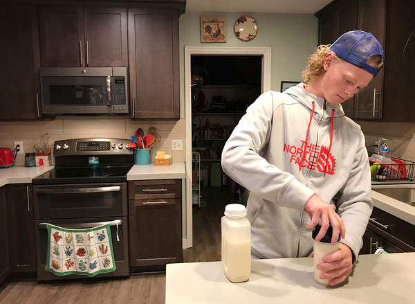 Jonah Reeder prepares a special protein shake that helps him manage a metabolic condition called phenylketonuria.