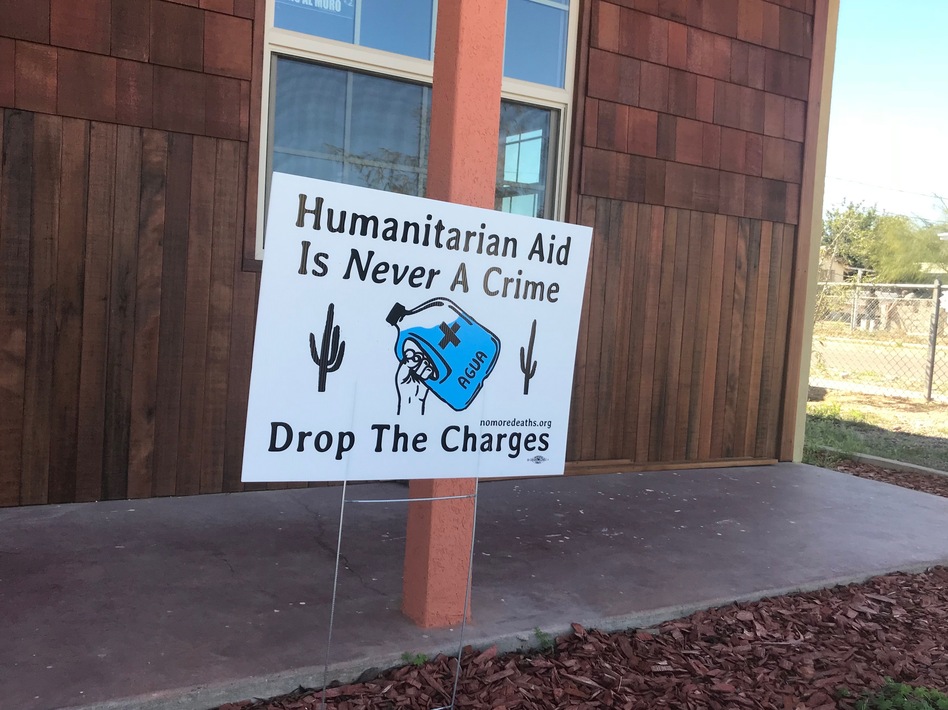 A yard sign in Ajo, Ariz., expressing support for migrant aid workers.