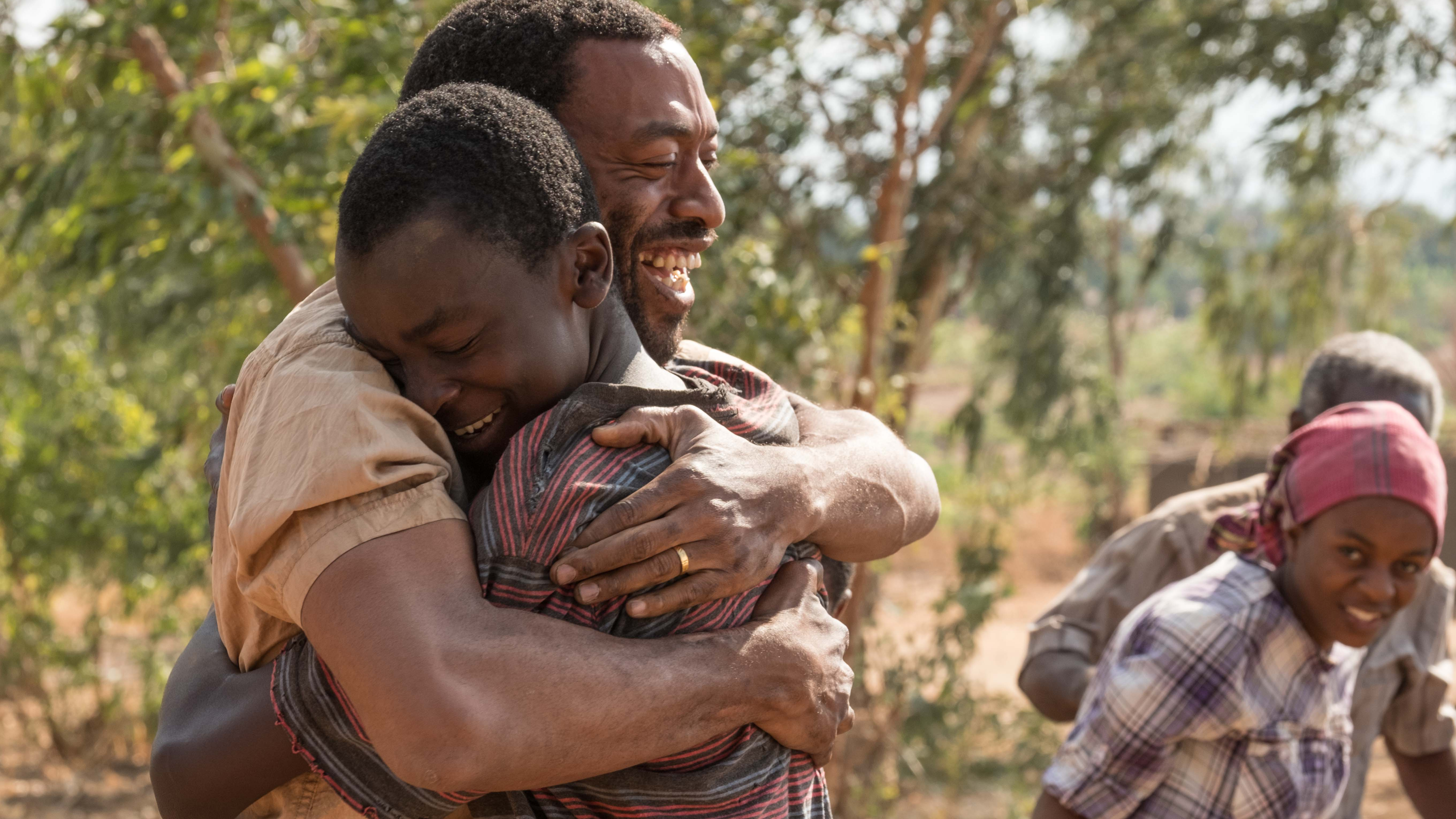 In The Boy Who Harnessed the Wind, Chiwetel Ejiofor (left) plays Trywell, the father of titular teenager William Kamkwamba (played by Maxwell Simba). Ejiofor also directed the movie and wrote the screenplay.