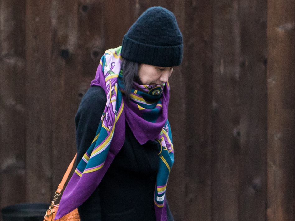 Meng Wanzhou, chief financial officer of Chinese telecom company Huawei, is seen here leaving her home under the supervision of security in Vancouver, British Columbia, in December. On Friday, Canada said that an extradition hearing in Meng's case can proceed. (Bloomberg/Bloomberg via Getty Images)