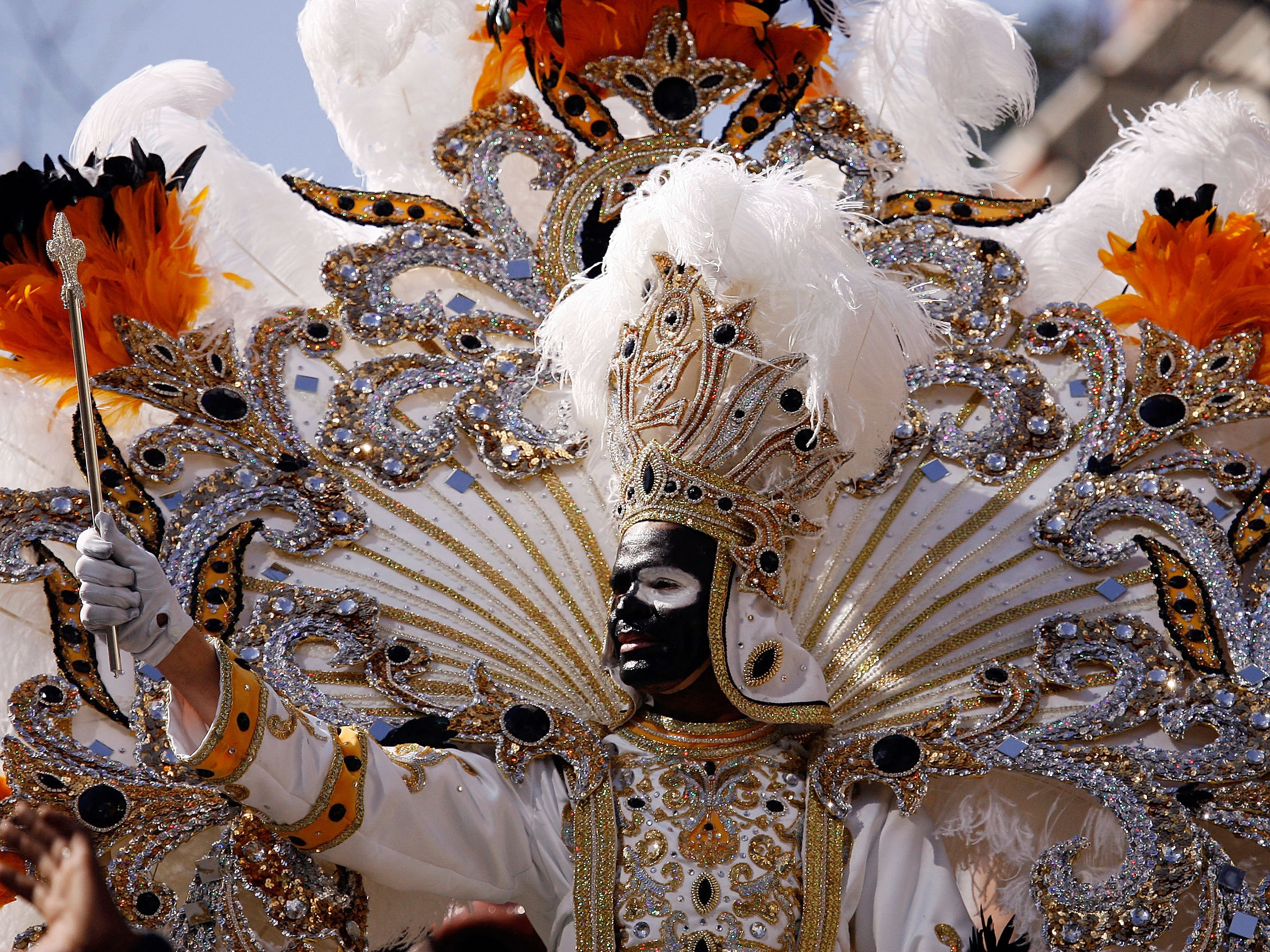 King Zulu waves to the crowds from his float on Mardi Gras day on Feb. 24, 2009 in New Orleans. The Zulu Social Aid & Pleasure Club is facing criticism for its tradition of wearing black face makeup during Mardi Gras.