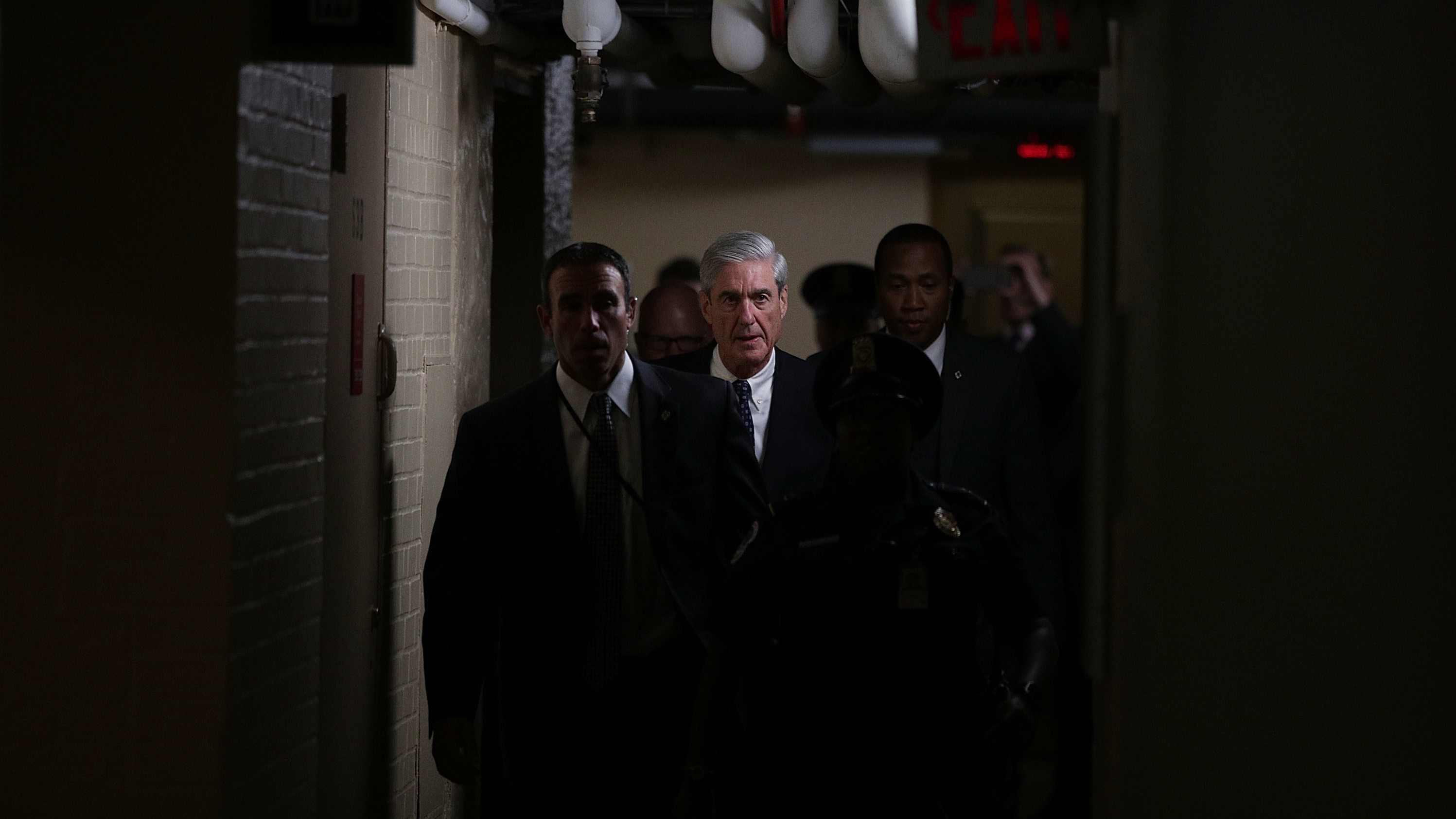 Justice Department special counsel Robert Mueller (center) leaves after a closed meeting with members of the Senate Judiciary Committee on June 21, 2017, at the Capitol in Washington, D.C. (Getty Images)