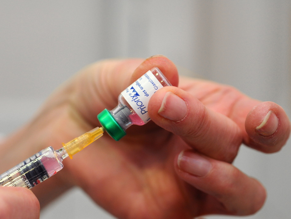 An MMR vaccination, immunizing against measles, mumps and rubella, is seen in the Health and Prevention Centre in Lyon, France.