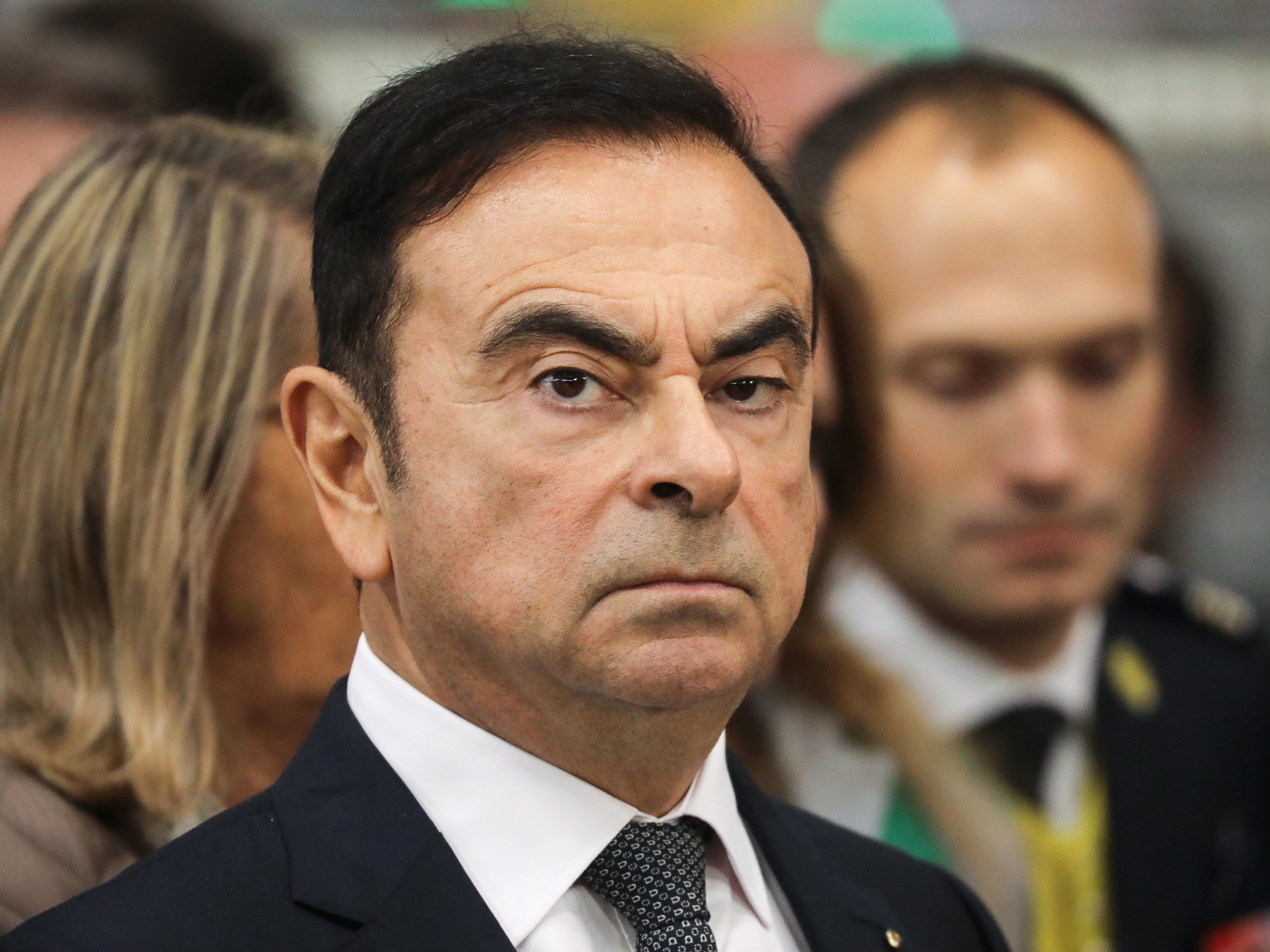 Then Chairman and CEO of Renault-Nissan-Mitsubishi Carlos Ghosn looks on during a visit of French President Emmanuel Macron at the Renault factory weeks before his November arrest. (AFP/Getty Images)