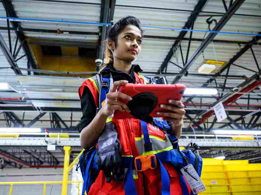 A woman uses a computer to control robots at the 855,000-square-foot Amazon fulfillment center in Staten Island, one of the five boroughs of New York City, on February 5, 2019.