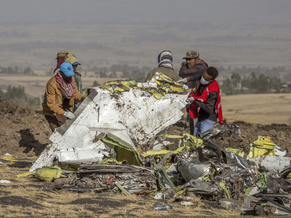 Responders at the scene of an Ethiopian Airlines flight crash. Countries around the world have grounded their Boeing 737 Max jets and there is growing political pressure on the Federal Aviation Administration to do the same.