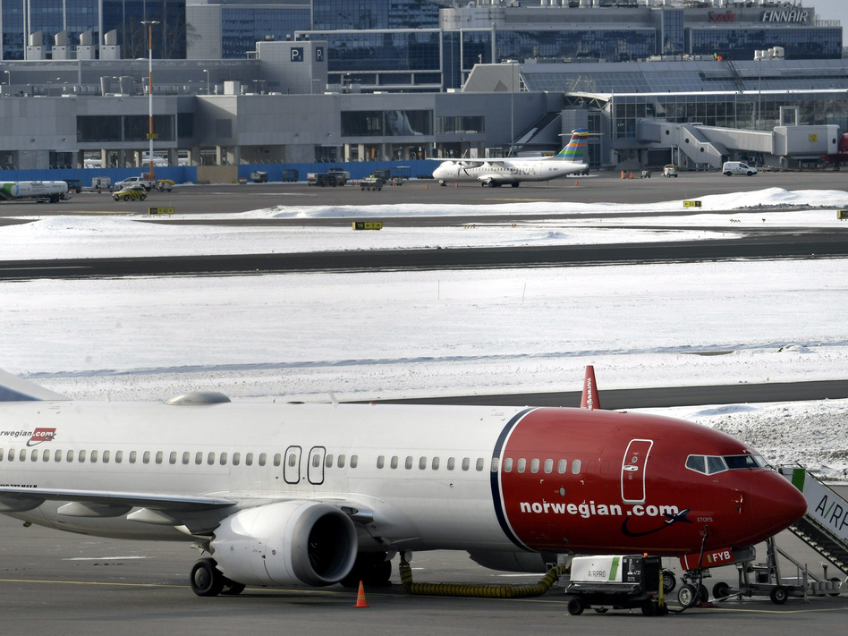 A Norwegian Air Boeing 737 Max 8 is parked on the tarmac at Helsinki Airport on Wednesday after the airplane model was grounded in most of the world.