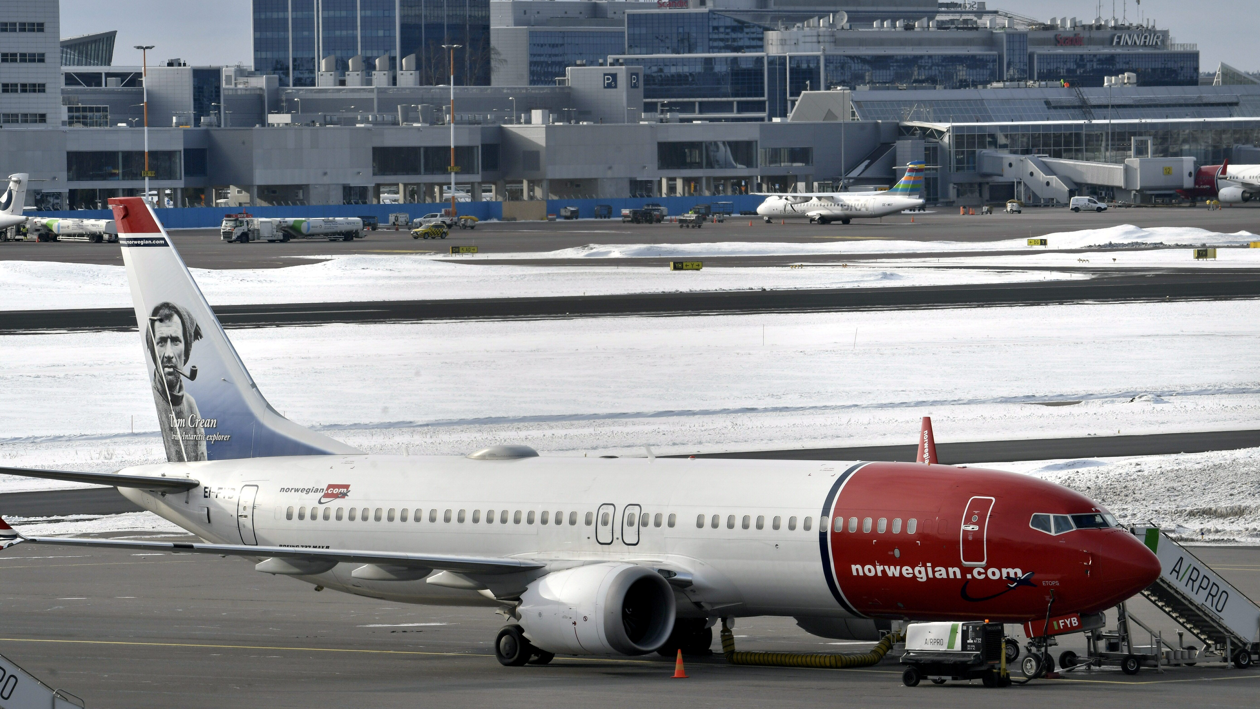 A Norwegian Air Boeing 737 Max 8 is parked on the tarmac at Helsinki Airport on Wednesday after the airplane model was grounded in most of the world. (Reuters)