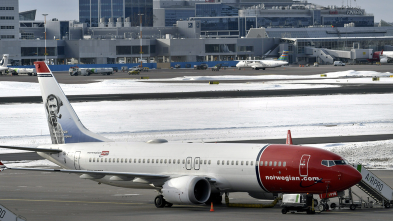 A Norwegian Air Boeing 737 Max 8 is parked on the tarmac at Helsinki Airport on Wednesday after the airplane model was grounded in most of the world. (Lehtikuva/Heikki Saukkomaa/Reuters)