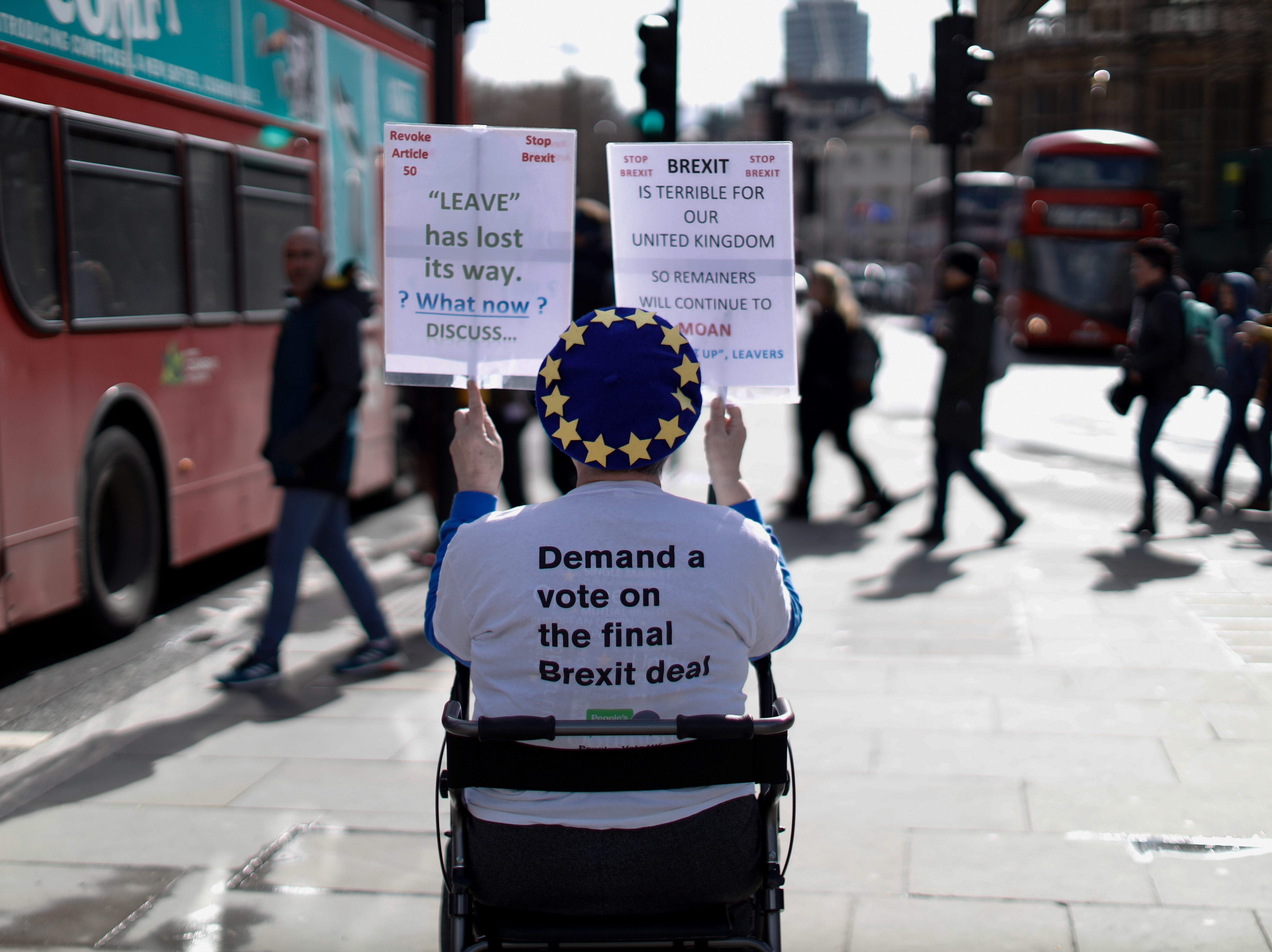 An anti-Brexit activist demonstrates outside of the Houses of Parliament in London on Thursday, before a vote on whether to postpone Britain's exit from the European Union.