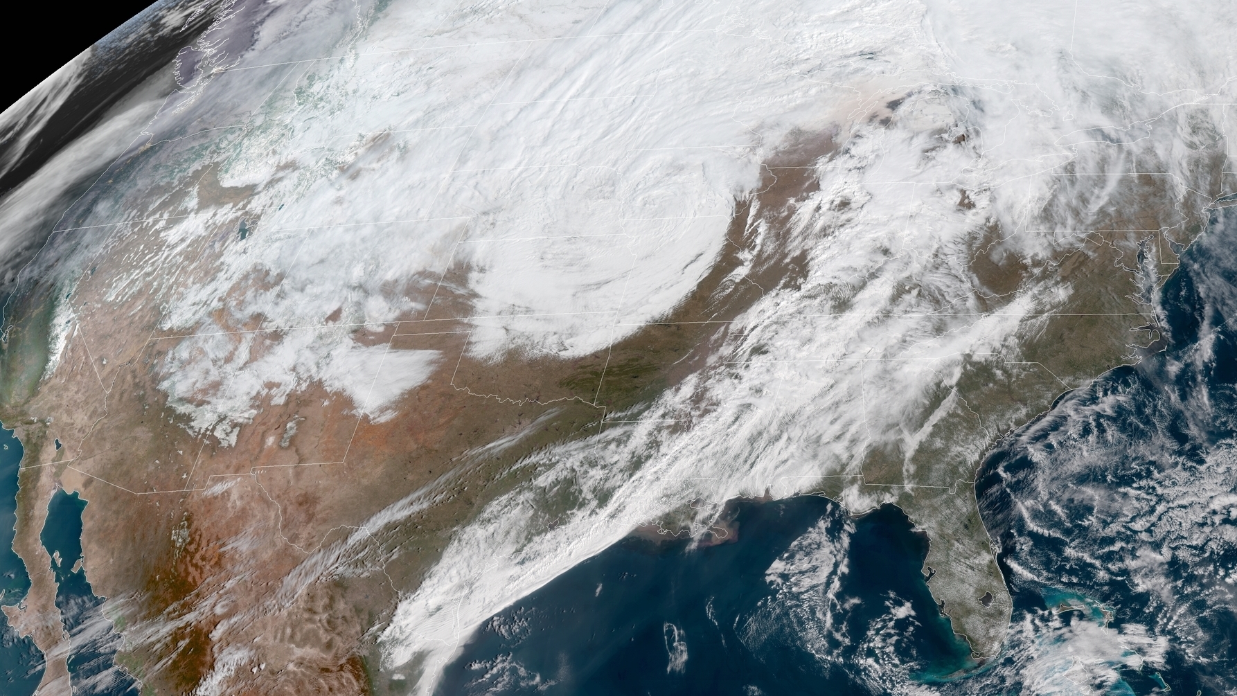 A massive late winter storm is bringing blizzard conditions to a number of central U.S. states Thursday. In affected areas, many agencies are shutting down and urging people to stay off the roads. (NASA/NOAA GOES Project)
