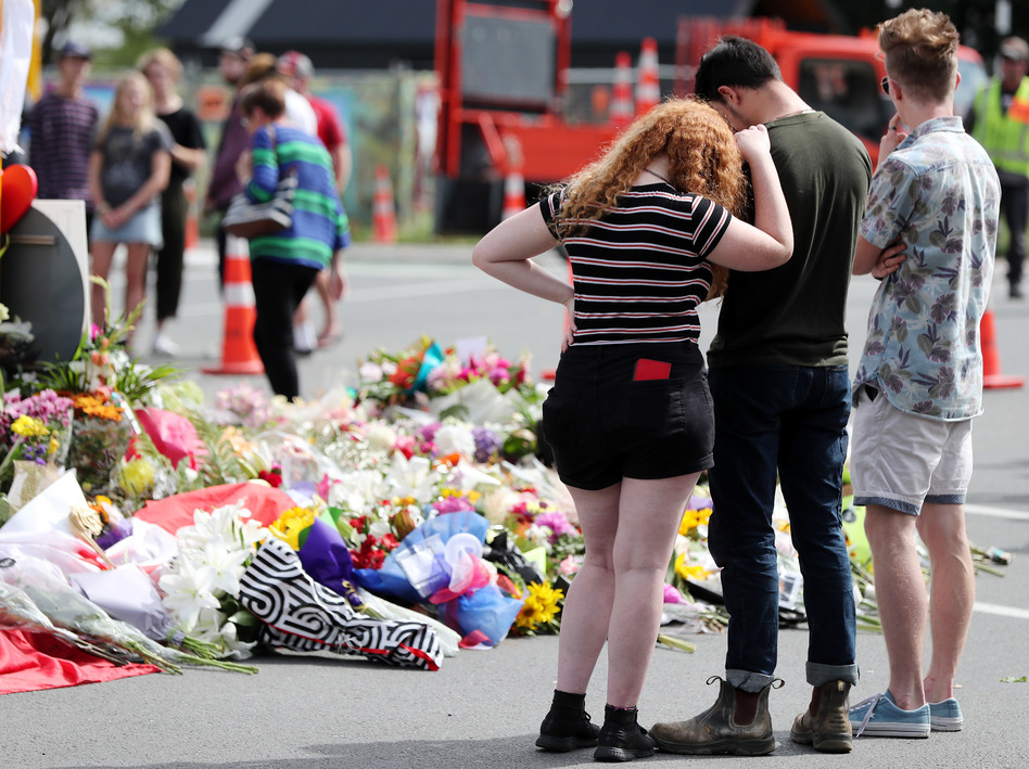 Residents pay their respects by placing flowers for the victims of the mosques attacks in Christchurch. (Michael Bradley/AFP/Getty Images)